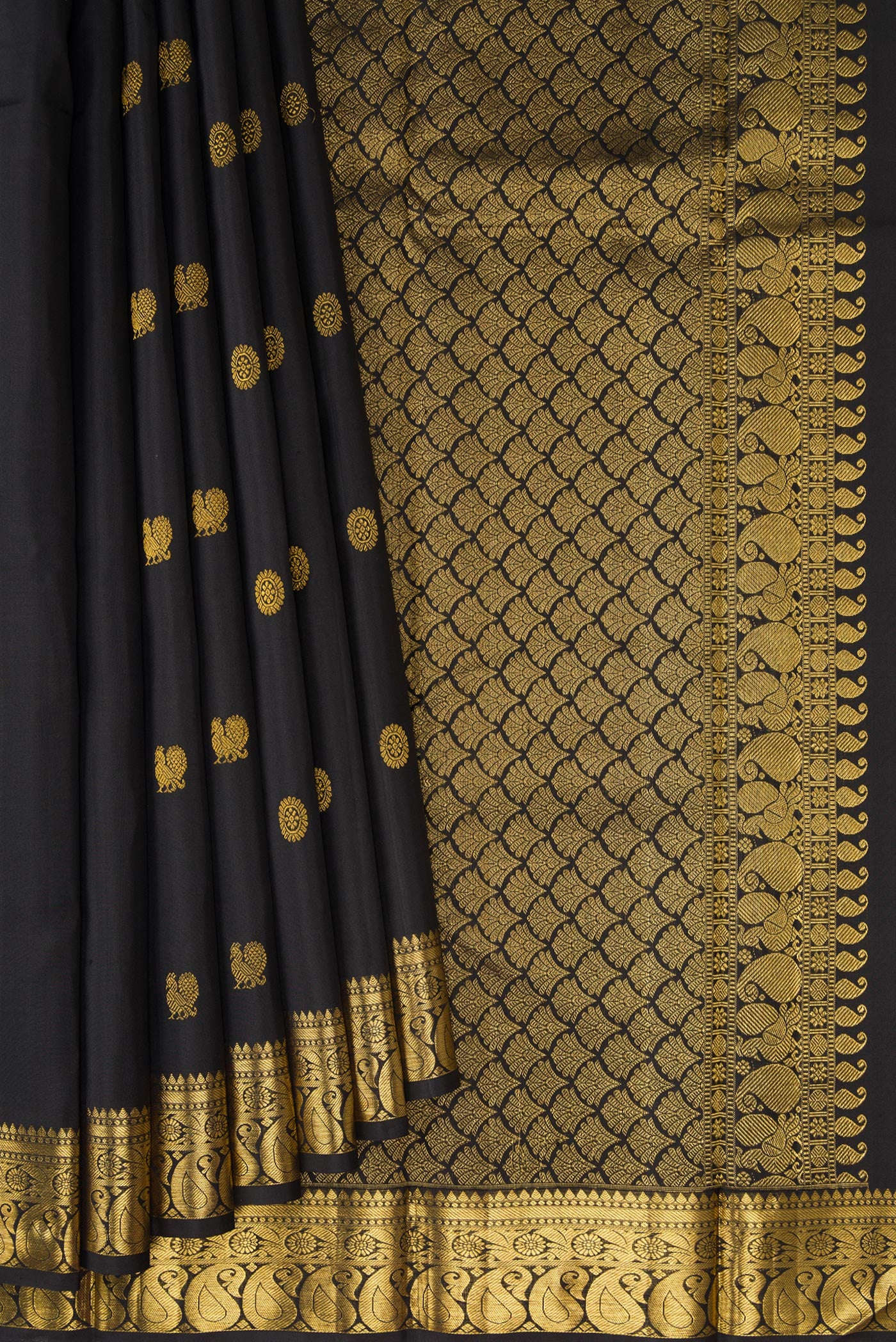 Pleats and pallu of Black Kanjivaram Silk Saree with Zari Butta on the body and Zari Border. 