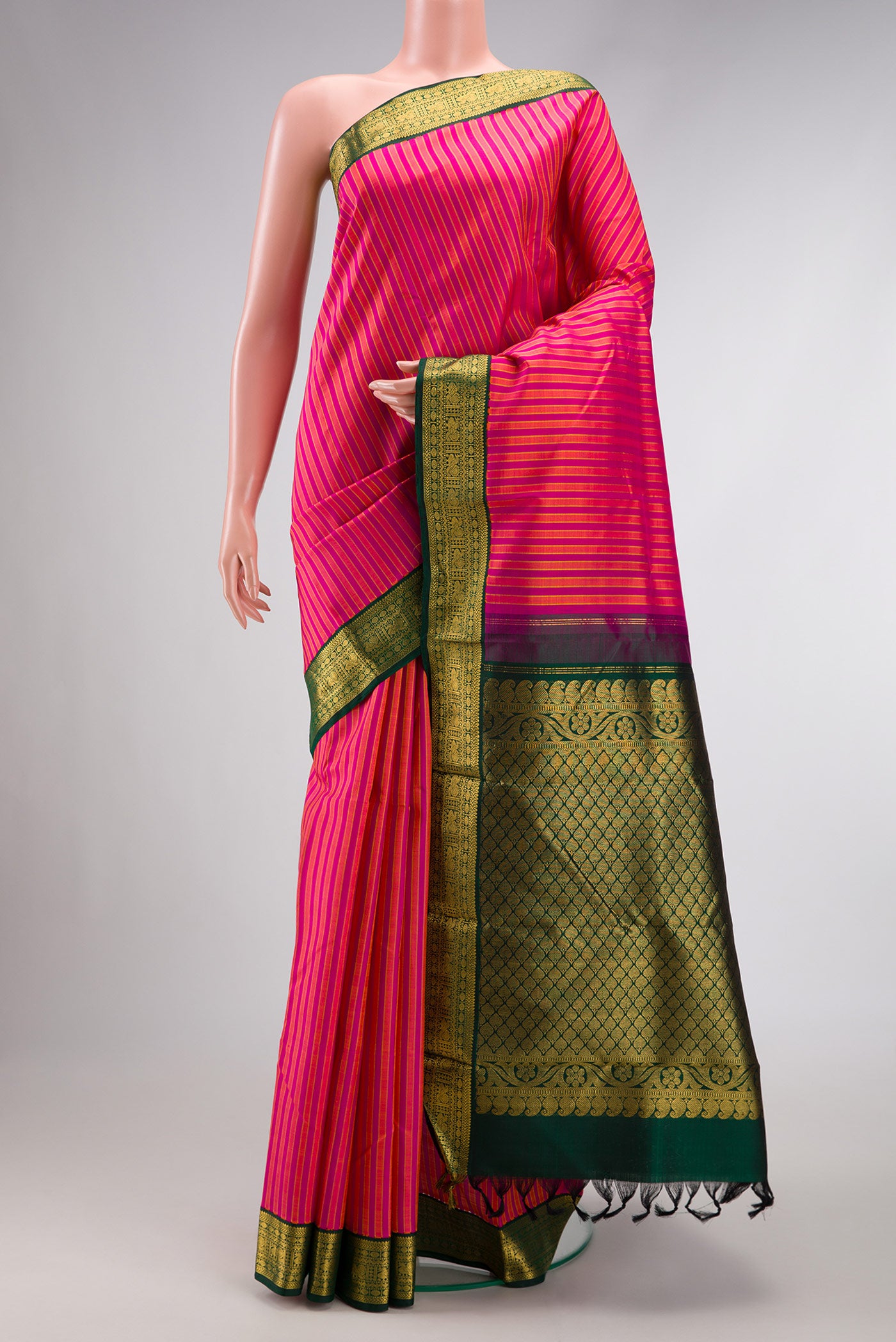 Pure Silk Pure Zari Dark Pink Dual Tone Kanjivaram Saree with Stripes on the body and Zari Border.  displayed on a mannequin