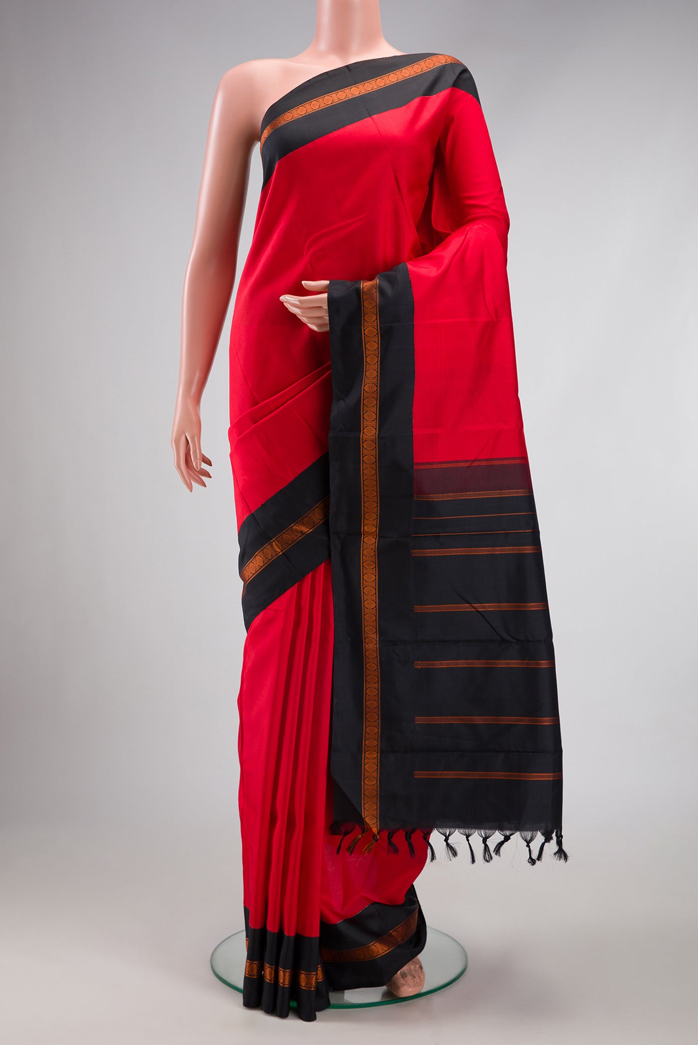 Red Dual Tone Banarasi Silk Saree with Plain Body and Thread Border.  displayed on a mannequin