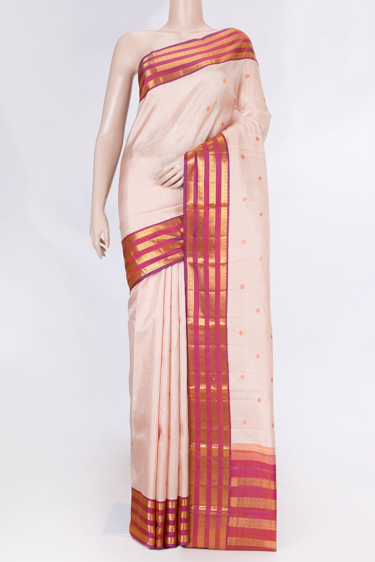 Peach Dual Tone Kanchipuram Saree with Thread Butta on the body and Zari Border displayed on a mannequin
