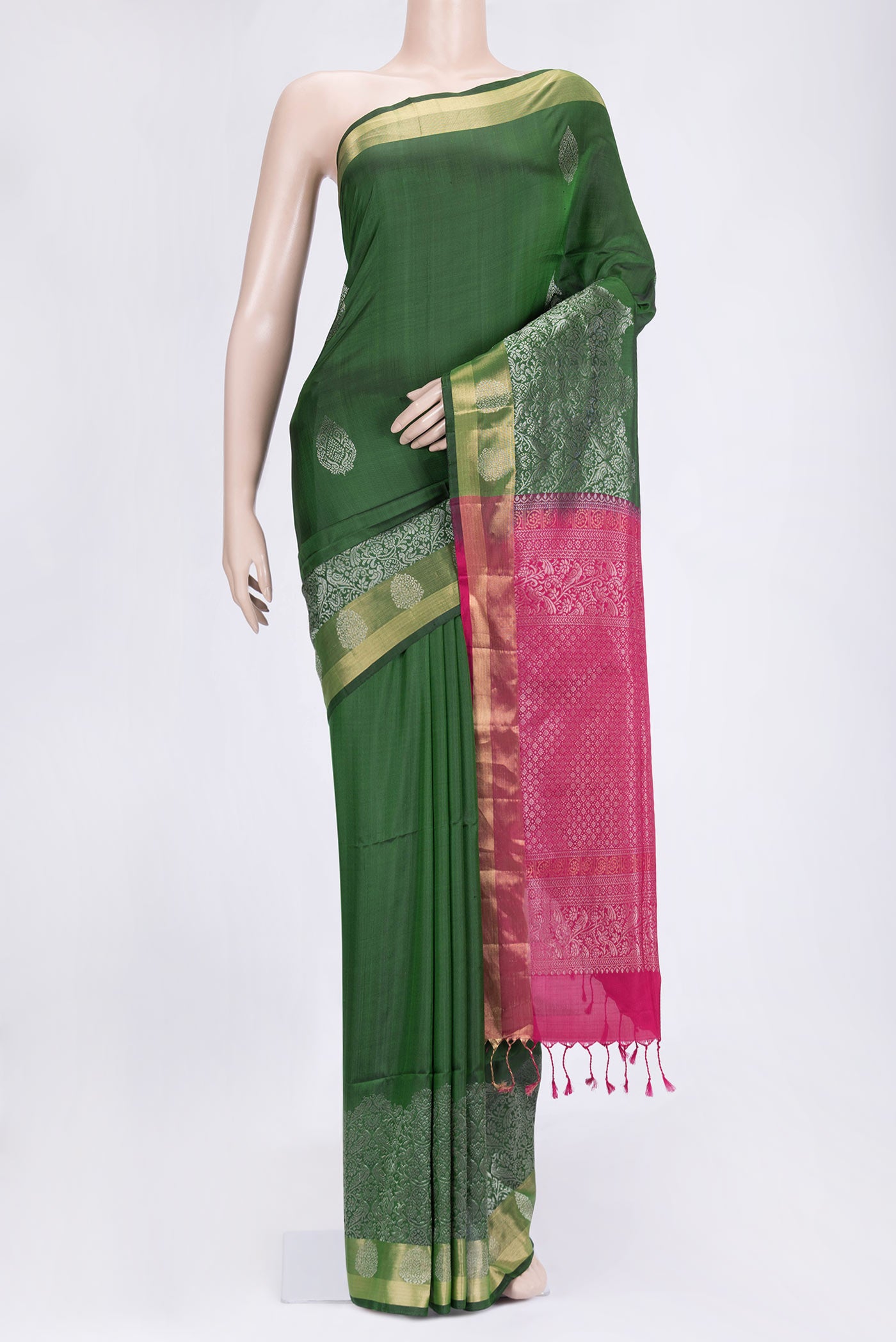 Bottle Green Dual Tone Soft Silk Saree with Zari Butta on the body and Zari Border.  displayed on a mannequin