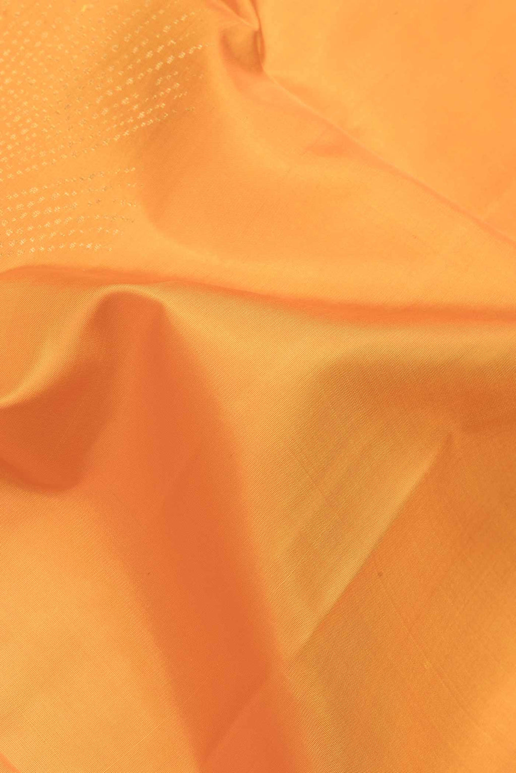 Close up of Yellow Dual Tone Soft Silk Saree with Zari Butta on the body and Zari Border.  displaying folds