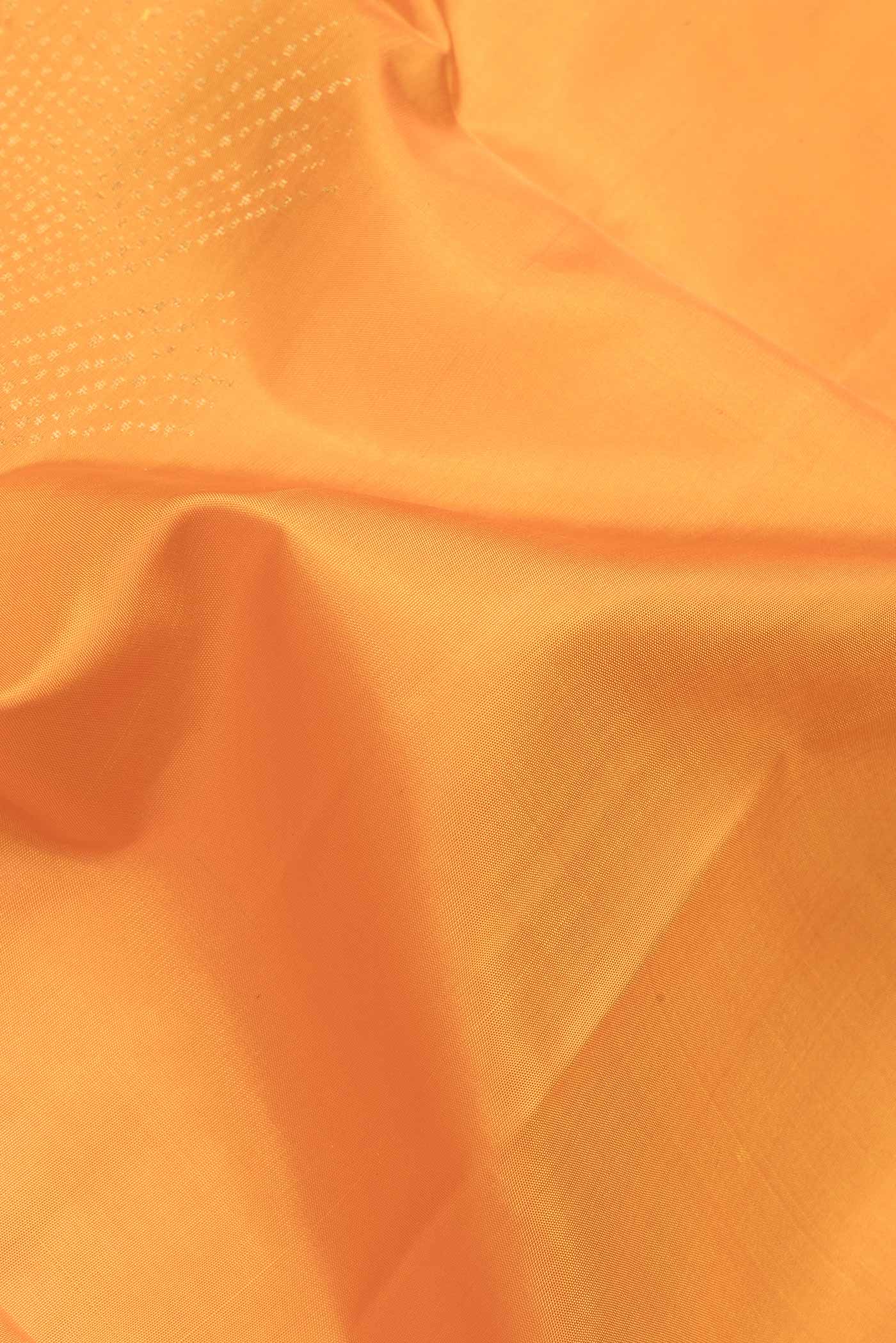 Close up of Yellow Dual Tone Soft Silk Saree with Zari Butta on the body and Zari Border.  displaying folds