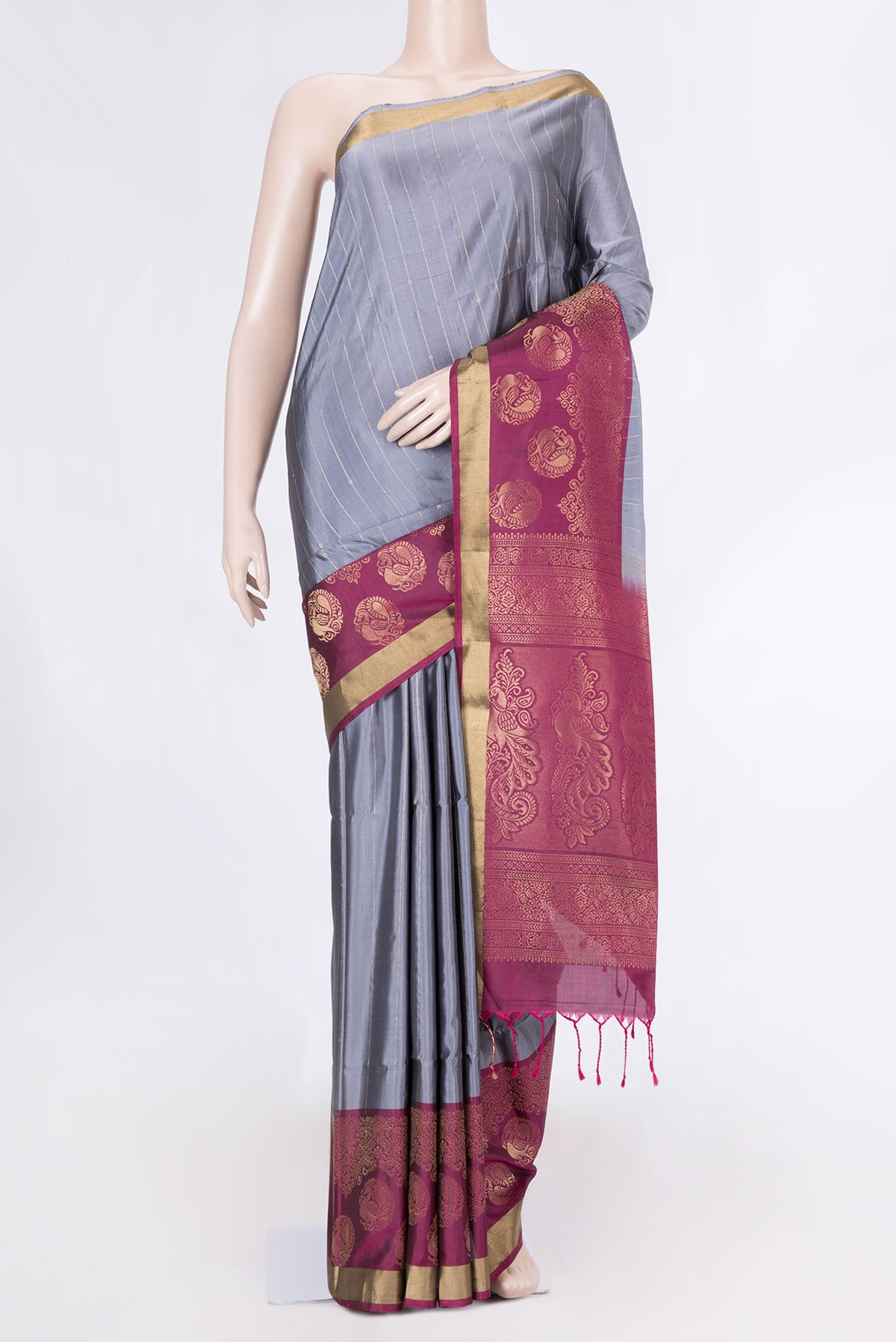 Grey Dual Tone Soft Silk Saree with Stripes on the body and Zari Border displayed on a mannequin