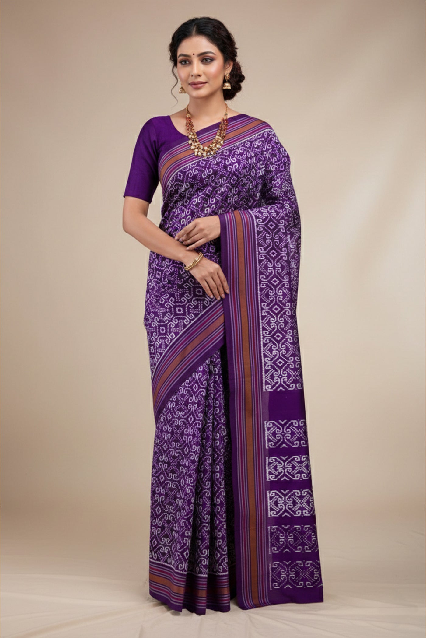 Model wearing a Dark Blue Pochampally Silk Saree with Pure Ikat on the body and Plain Border