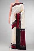 Sandal Dual Tone Double Ikat Saree with Plain Body and Ikat Border.  displayed on a mannequin