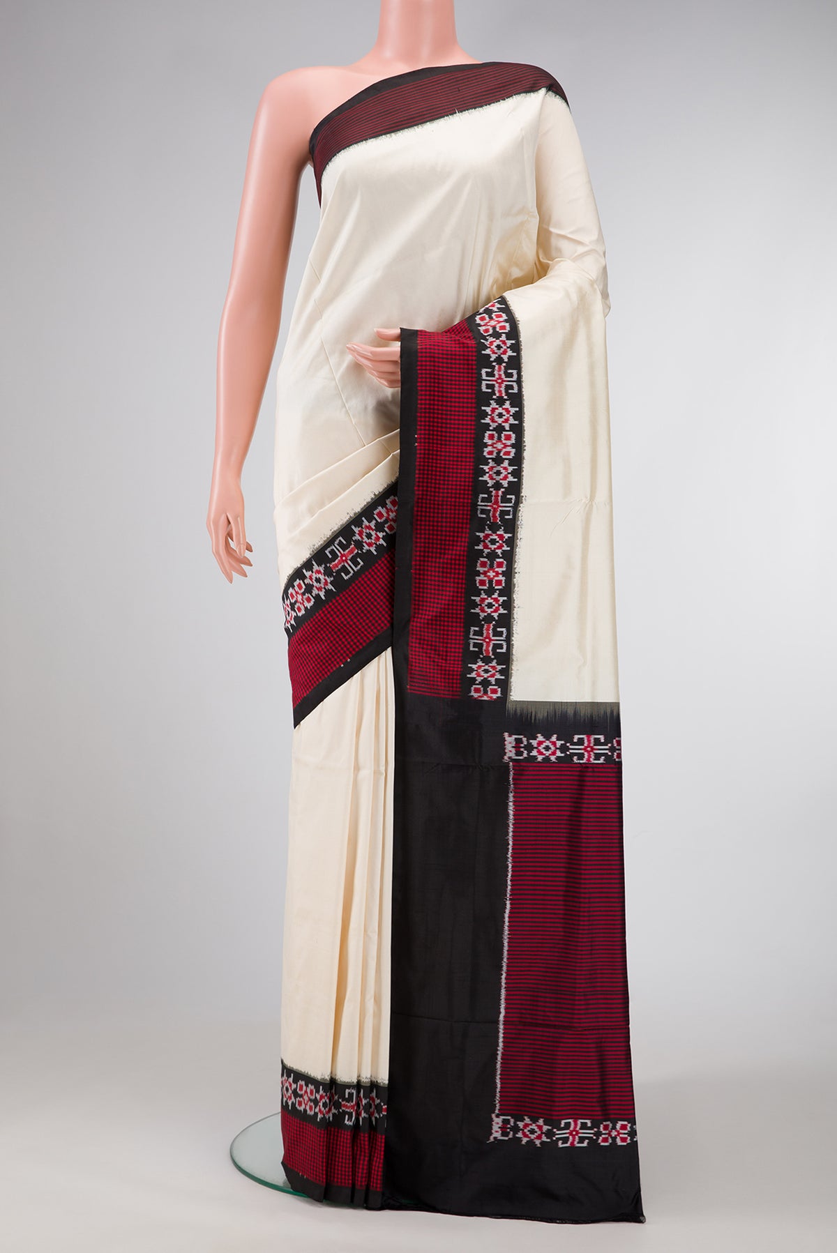 Sandal Dual Tone Double Ikat Saree with Plain Body and Ikat Border.  displayed on a mannequin