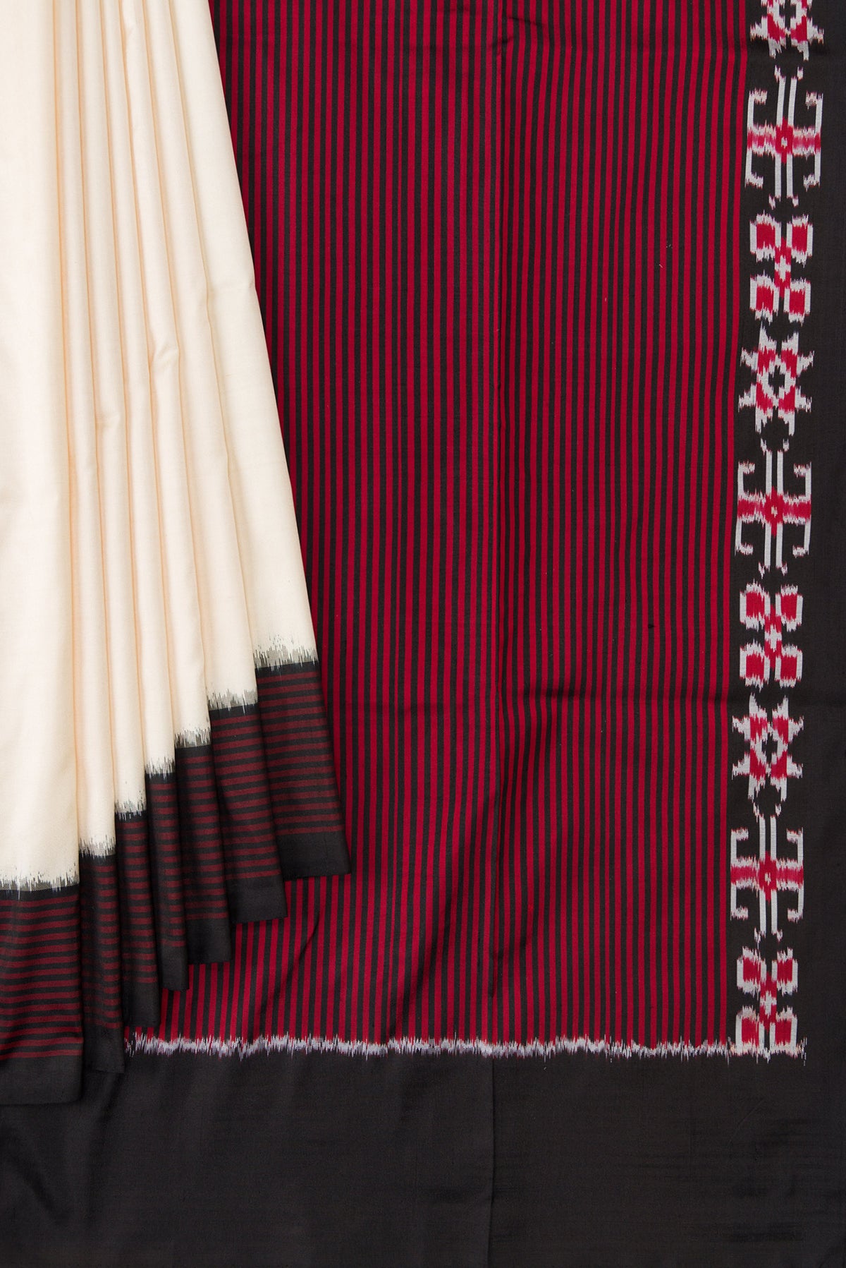 Pleats and pallu of Sandal Dual Tone Double Ikat Saree with Plain Body and Ikat Border. 