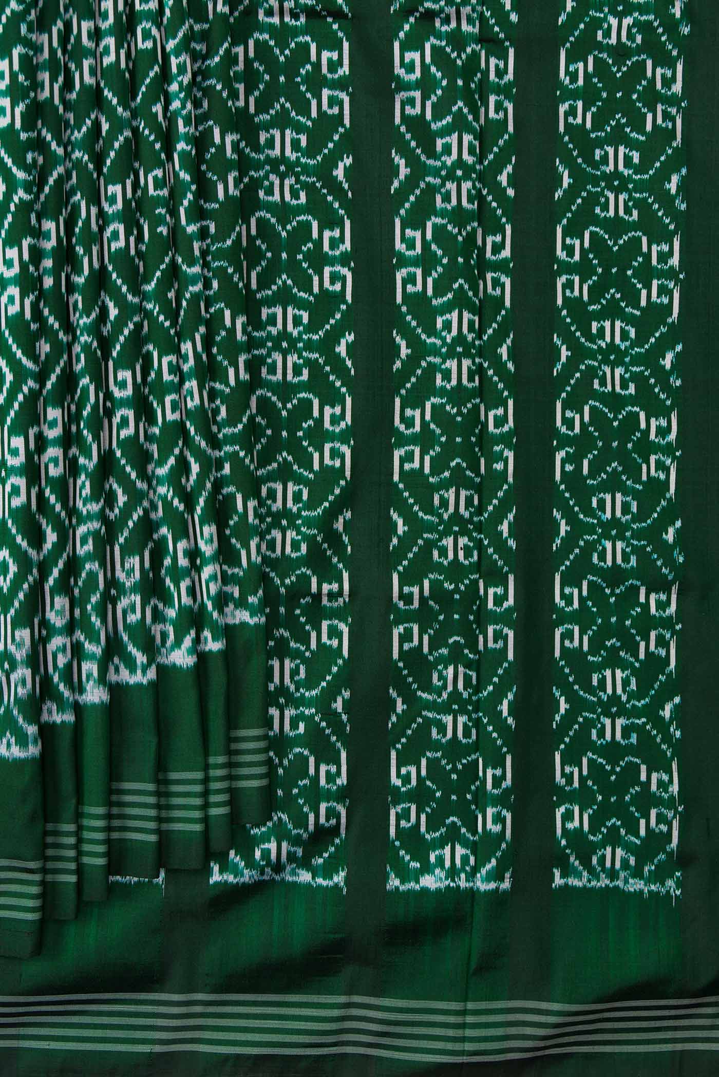 Pleats and pallu of Green Dual Tone Double Ikat Saree with Ikat Print on the body and Zari Border. 