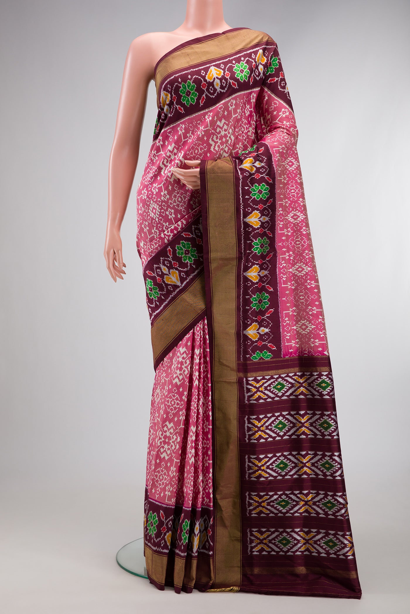 Pink Dual Tone Double Ikat Saree with Ikat Print on the body and Ikat Border.  displayed on a mannequin