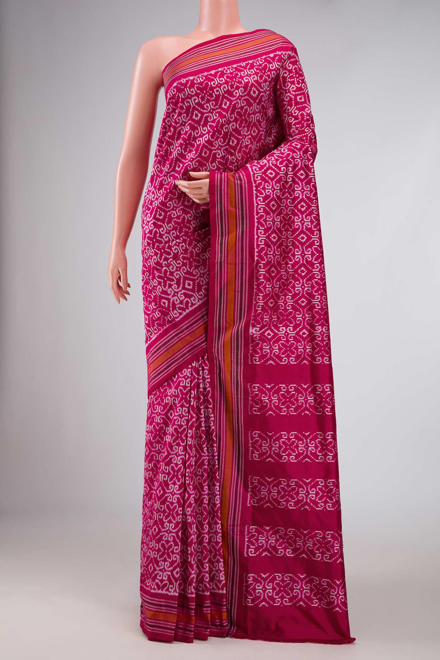 Pink Dual Tone Double Ikat Saree with Ikat Print on the body and Thread Border displayed on a mannequin