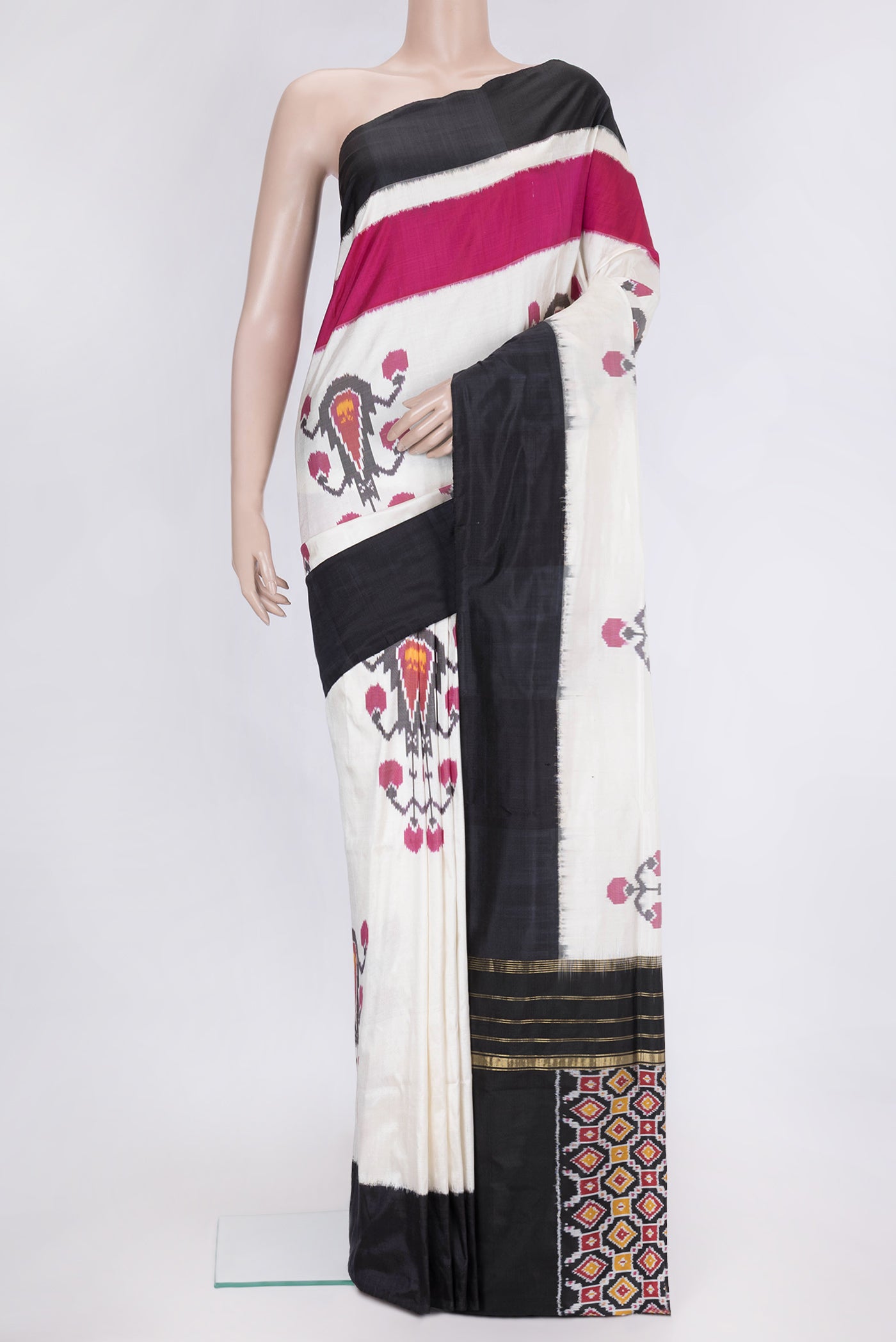 Off White Dual Tone Double Ikat Saree with Ikat Print on the body and Plain Border.  displayed on a mannequin