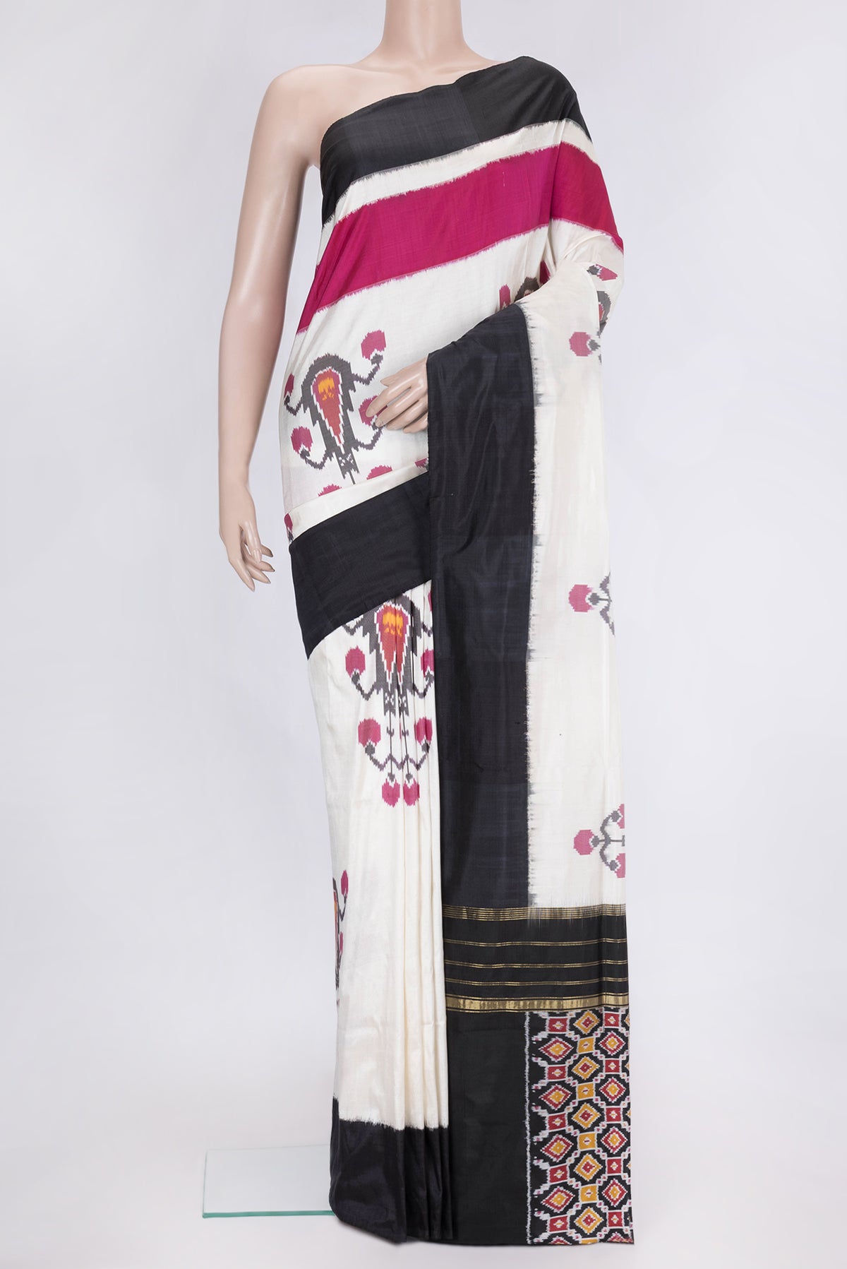 Off White Dual Tone Double Ikat Saree with Ikat Print on the body and Plain Border.  displayed on a mannequin