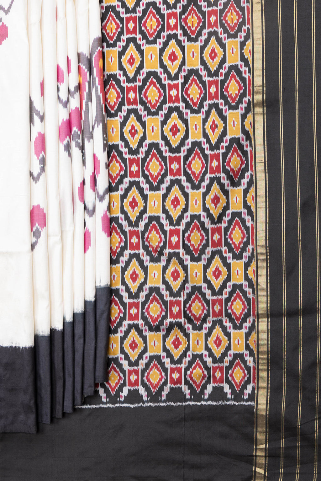 Pleats and pallu of Off White Dual Tone Double Ikat Saree with Ikat Print on the body and Plain Border. 