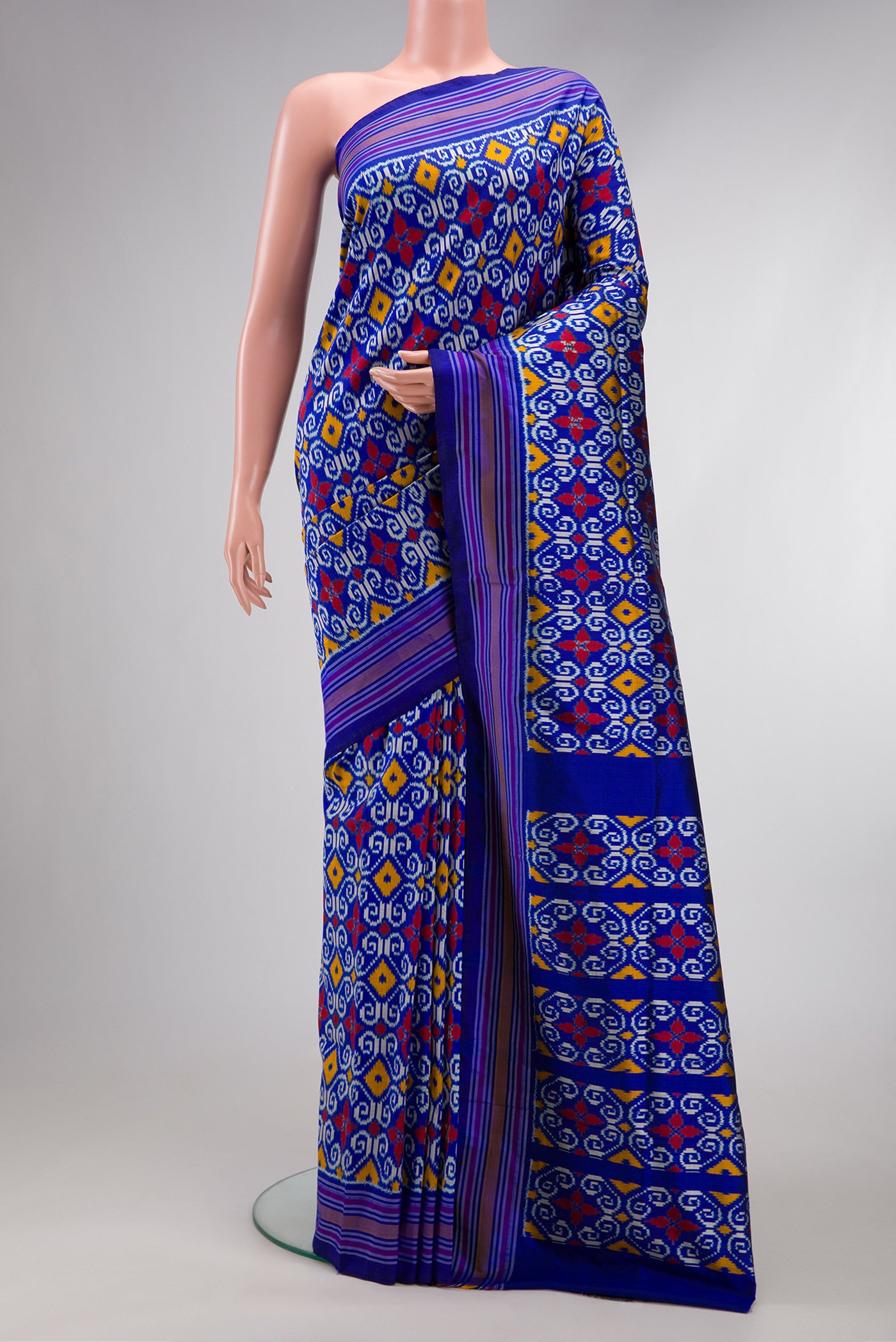 Navy Blue Dual Tone Double Ikat Saree with Ikat Print on the body and Thread Border.  displayed on a mannequin