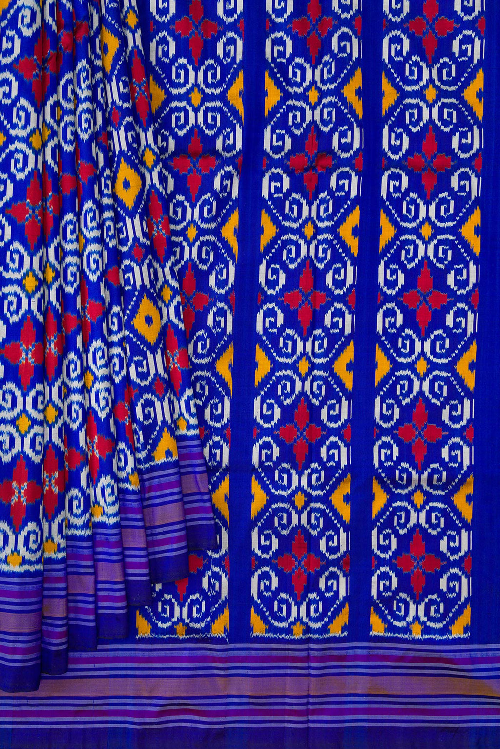 Pleats and pallu of Navy Blue Dual Tone Double Ikat Saree with Ikat Print on the body and Thread Border. 