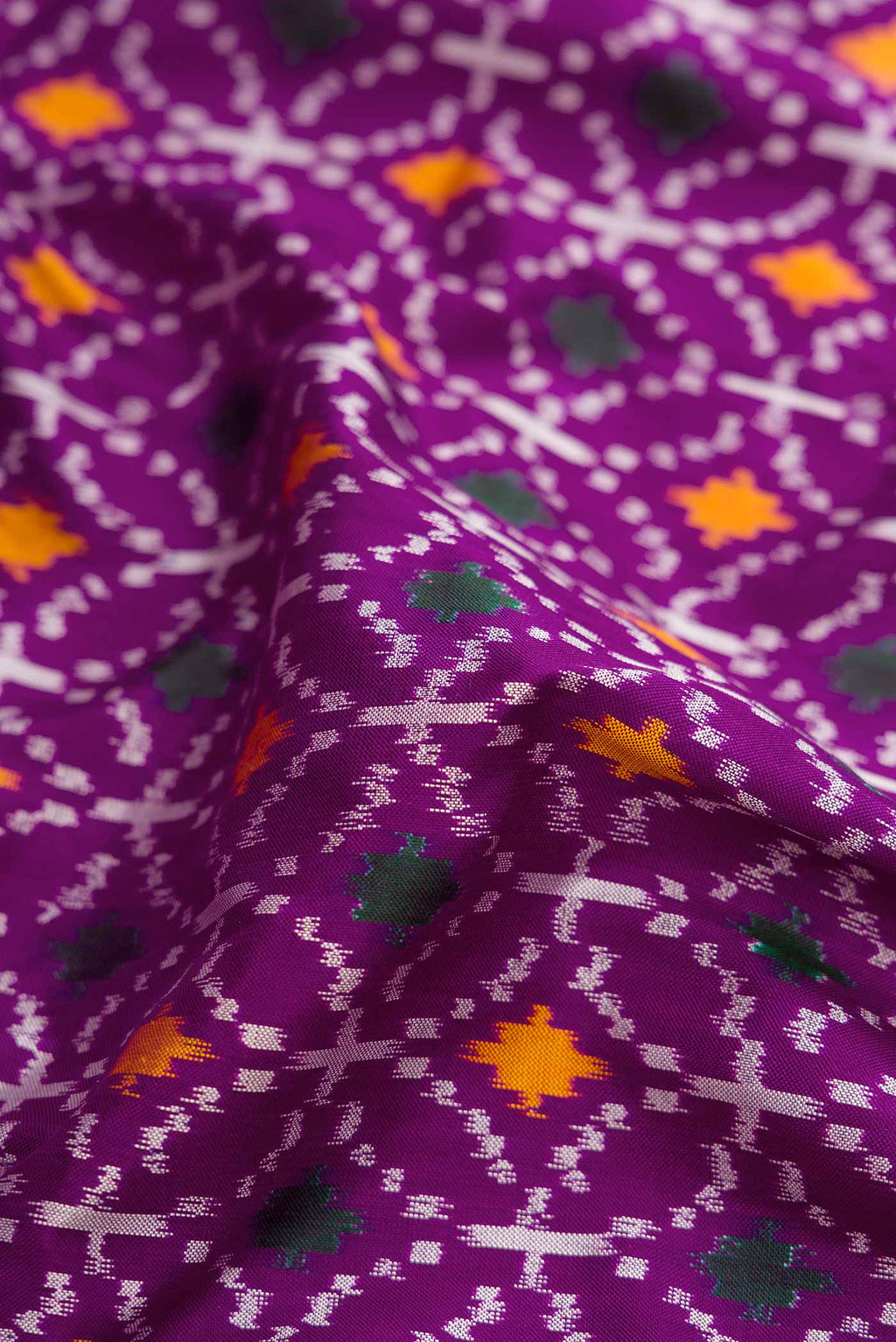 Close up of Purple Pochampally Silk Saree with Pure Ikat on the body and Plain Border displaying folds