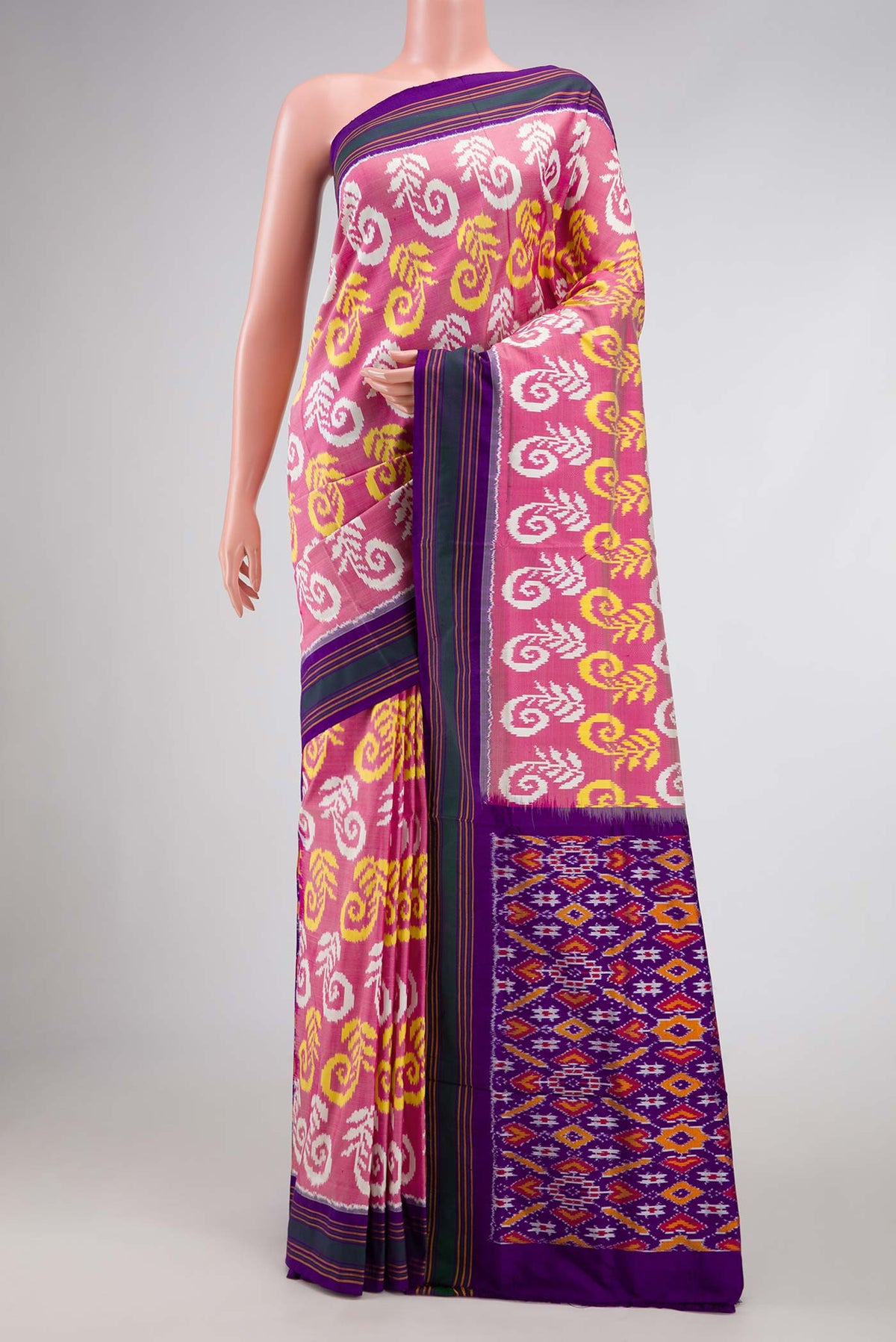 Rose pink Pochampally Silk Saree with Pure Ikat on the body and Plain Border displayed on a mannequin