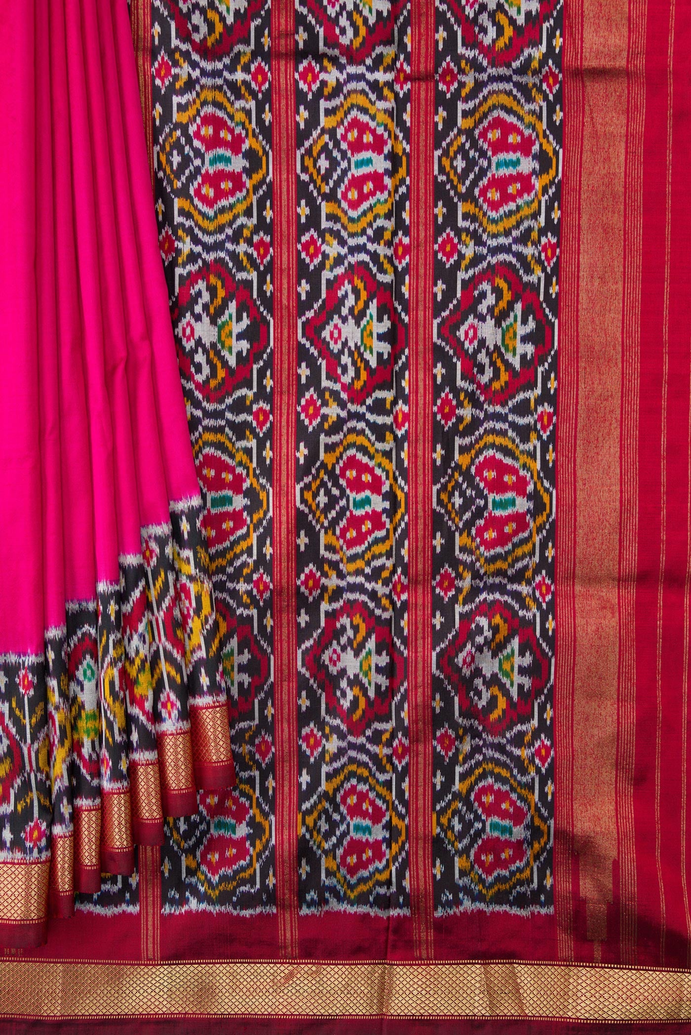 Pleats and pallu of Pink Dual Tone Double Ikat Saree with Plain Body and Ikat Border. 