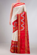 Off White Dual Tone Double Ikat Saree with Ikat Print on the body and Ikat Border displayed on a mannequin