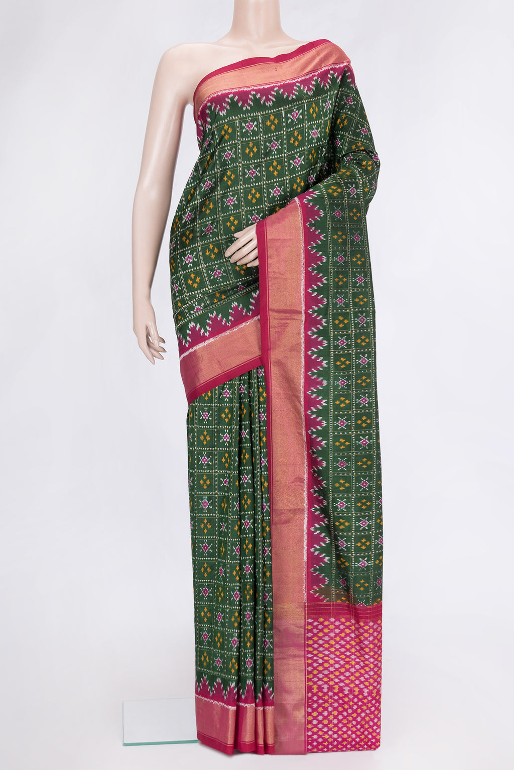Bottle Green Dual Tone Double Ikat Saree with Ikat Print on the body and Ikat Border.  displayed on a mannequin