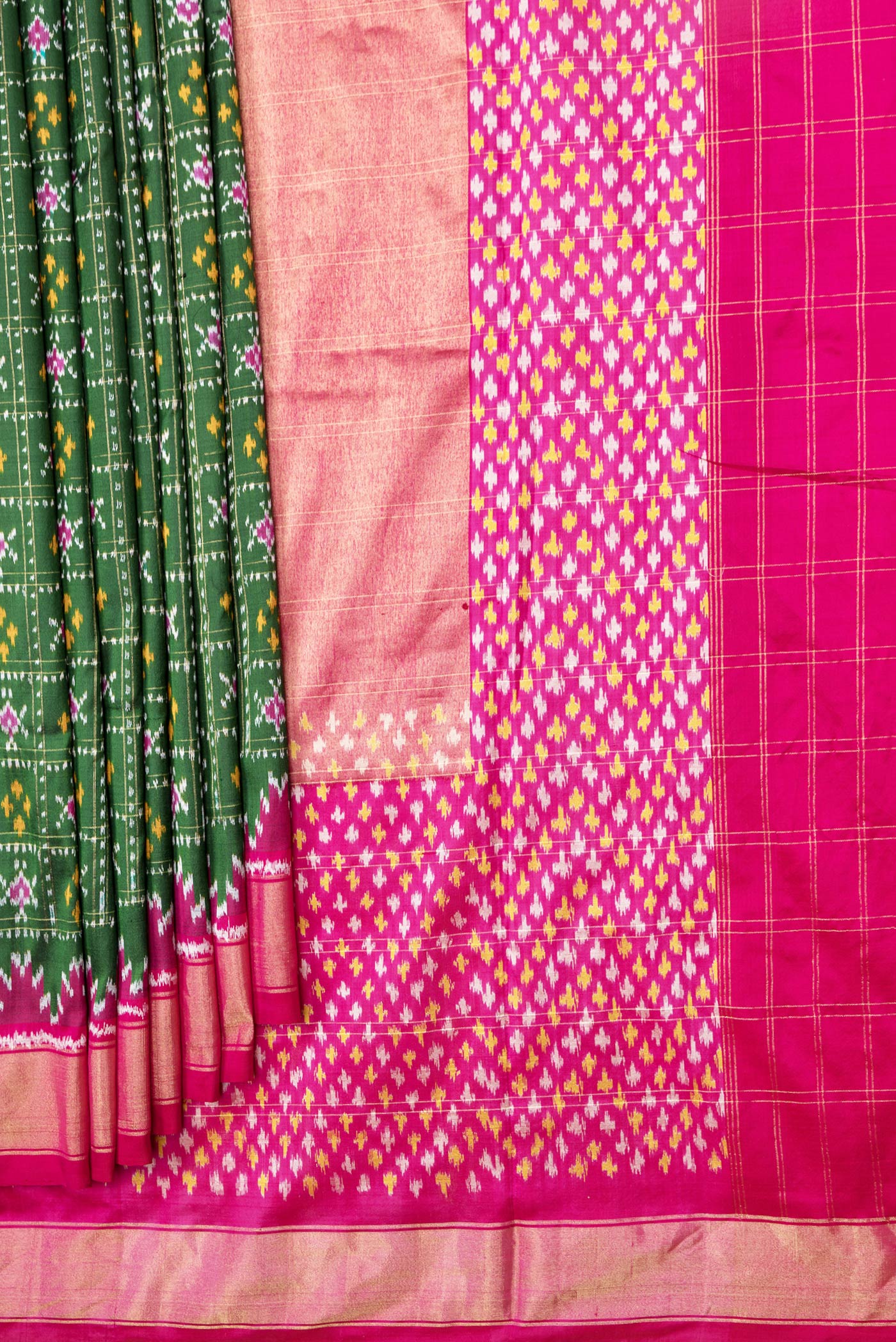 Pleats and pallu of Bottle Green Dual Tone Double Ikat Saree with Ikat Print on the body and Ikat Border. 