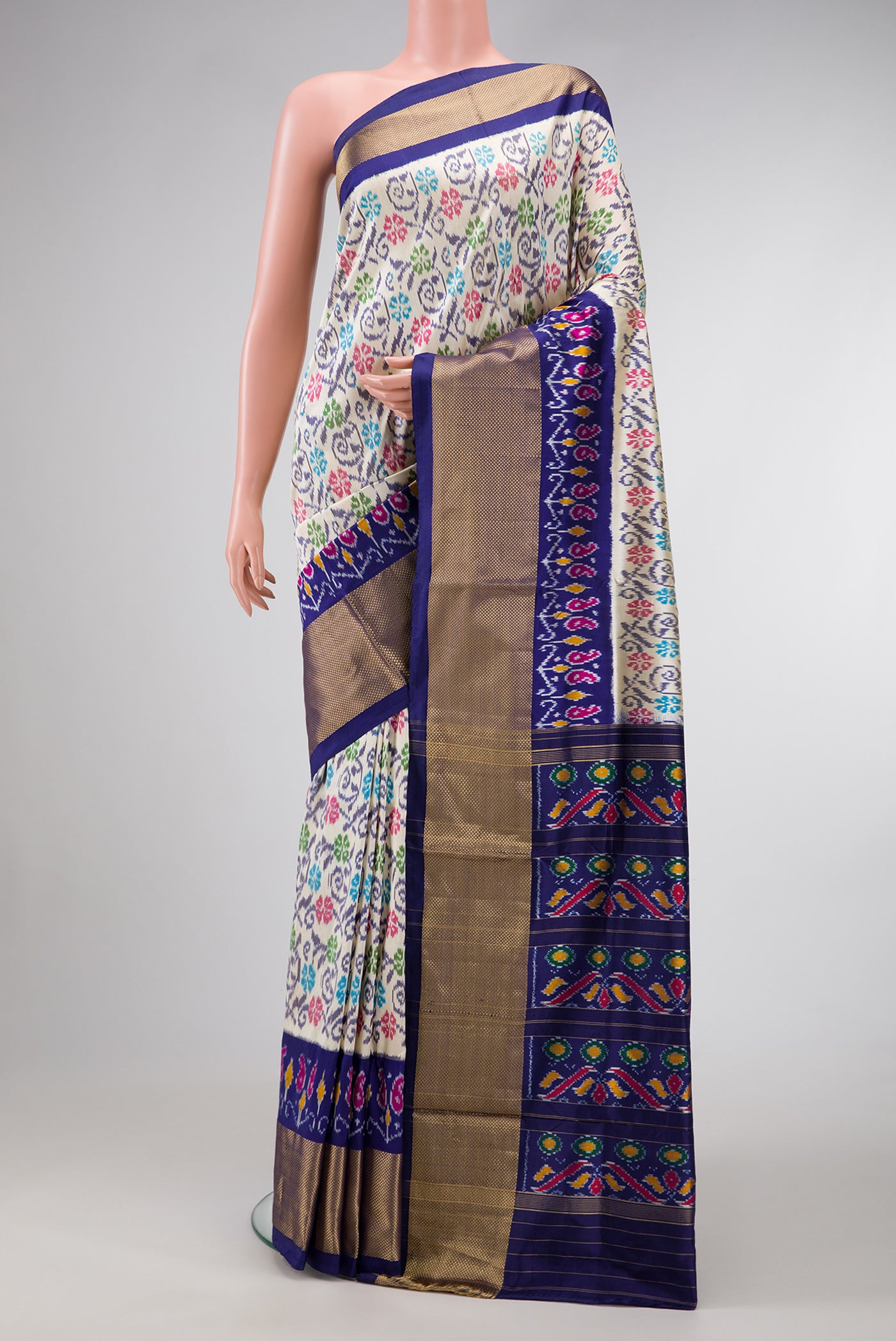 Off White Dual Tone Double Ikat Saree with Ikat Print on the body and Ikat Border.  displayed on a mannequin