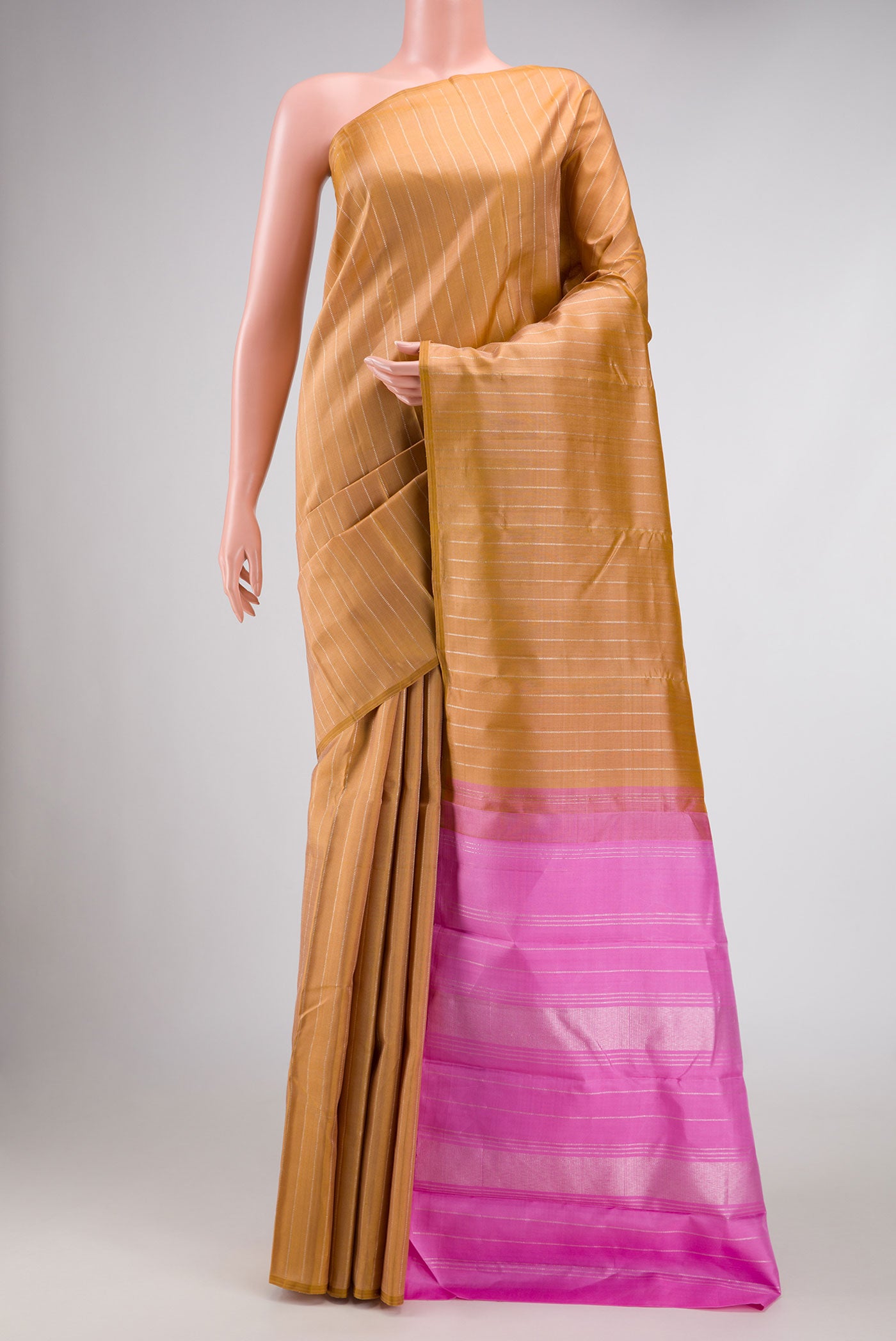 Gold Dual Tone Kanchipuram Silk Saree with Stripes on the body and Without Border displayed on a mannequin