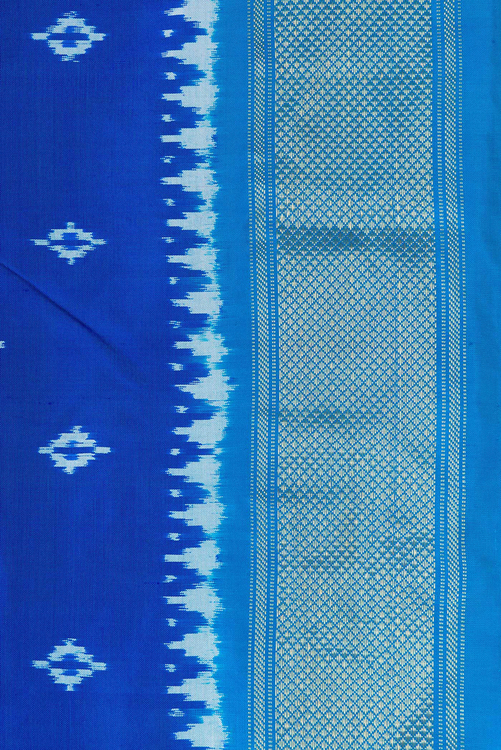 Border image of Peacock Blue Dual Tone Double Ikat Nine Yards Saree with Ikat Print on the body and Zari Border. 