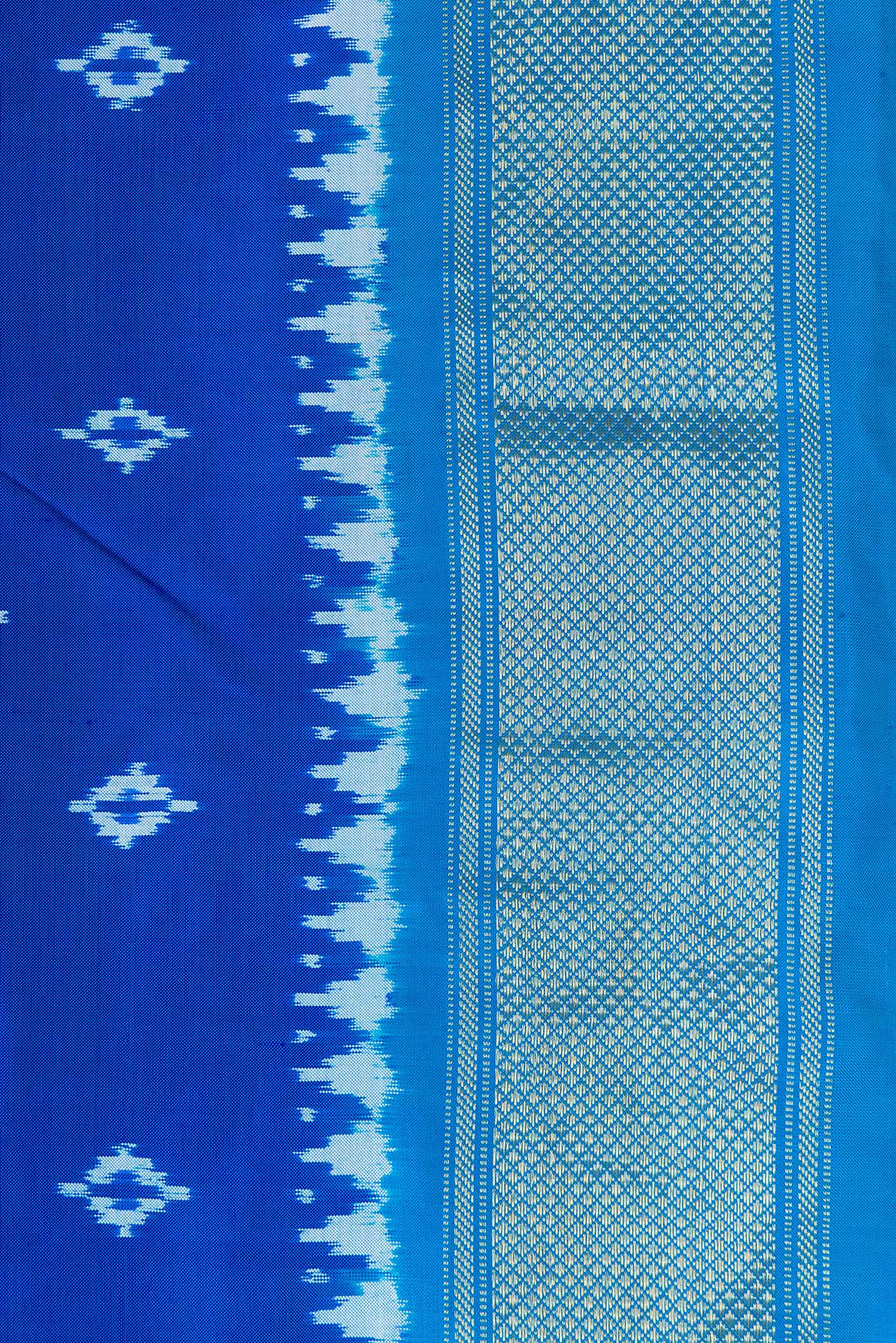 Border image of Peacock Blue Dual Tone Double Ikat Nine Yards Saree with Ikat Print on the body and Zari Border. 