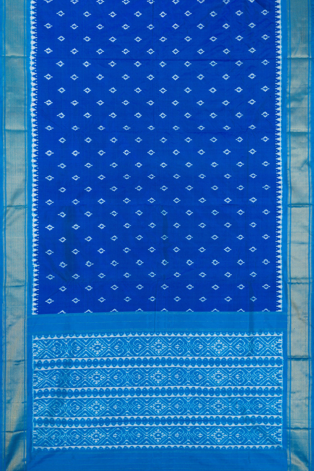 Flat view of Peacock Blue Dual Tone Double Ikat Nine Yards Saree with Ikat Print on the body and Zari Border. 