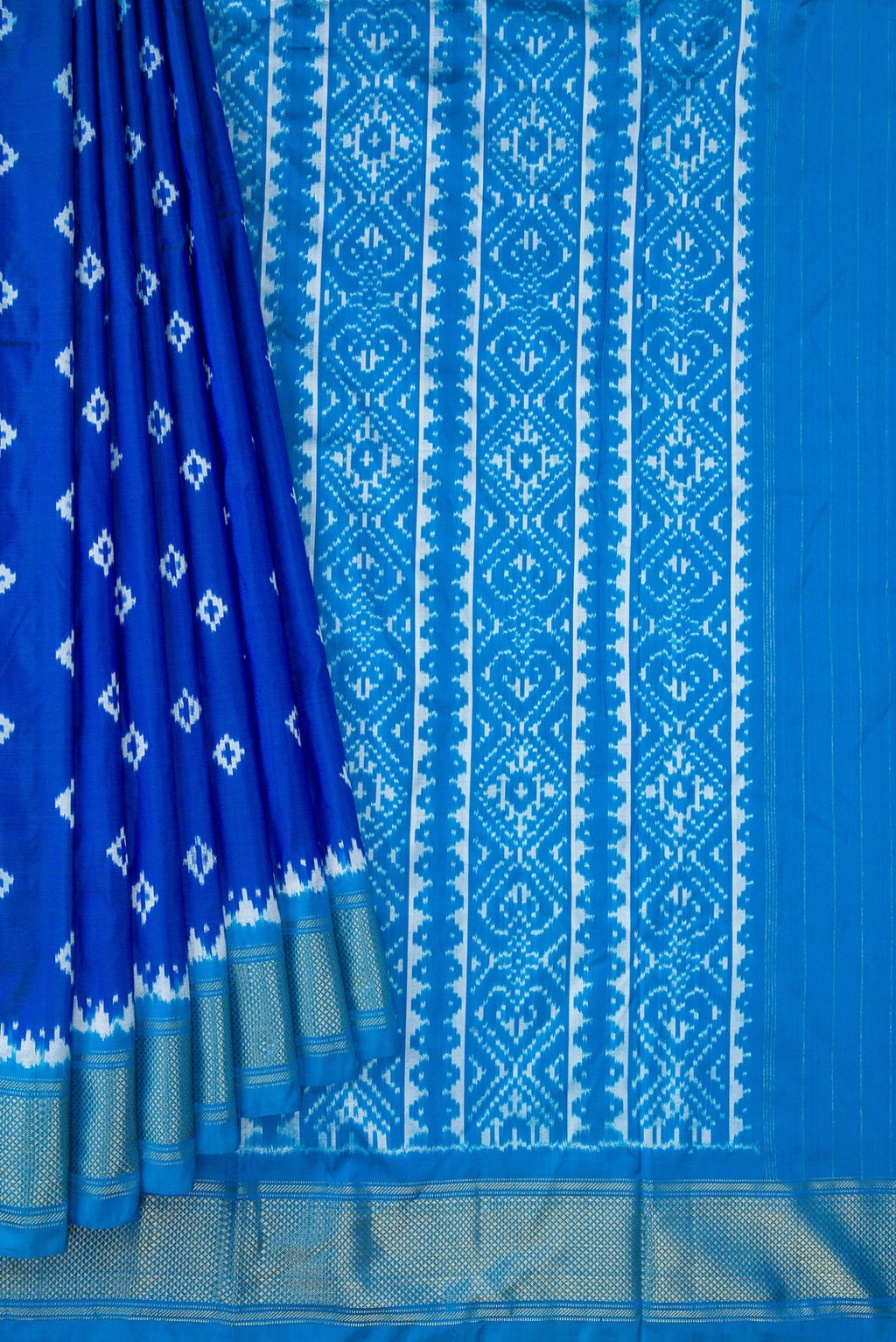 Pleats and pallu of Peacock Blue Dual Tone Double Ikat Nine Yards Saree with Ikat Print on the body and Zari Border. 