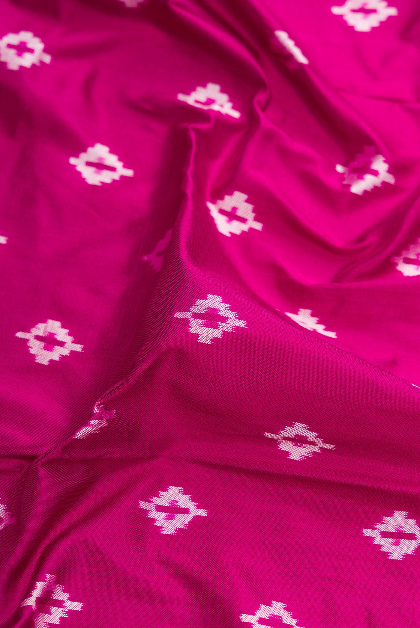 Close up of Purple Dual Tone Double Ikat Nine Yards Saree with Ikat Print on the body and Zari Border.  displaying folds