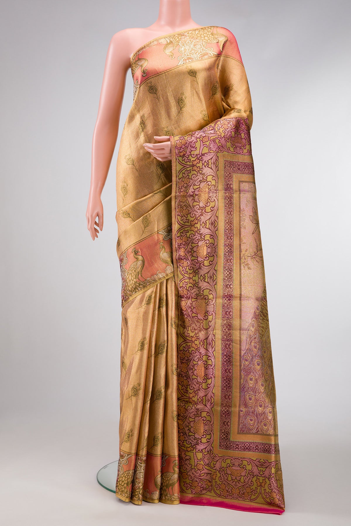 Gold Dual Tone Kanjivaram Tissue Silk Saree with Zari Brocade on the body and Fancy Border.  displayed on a mannequin