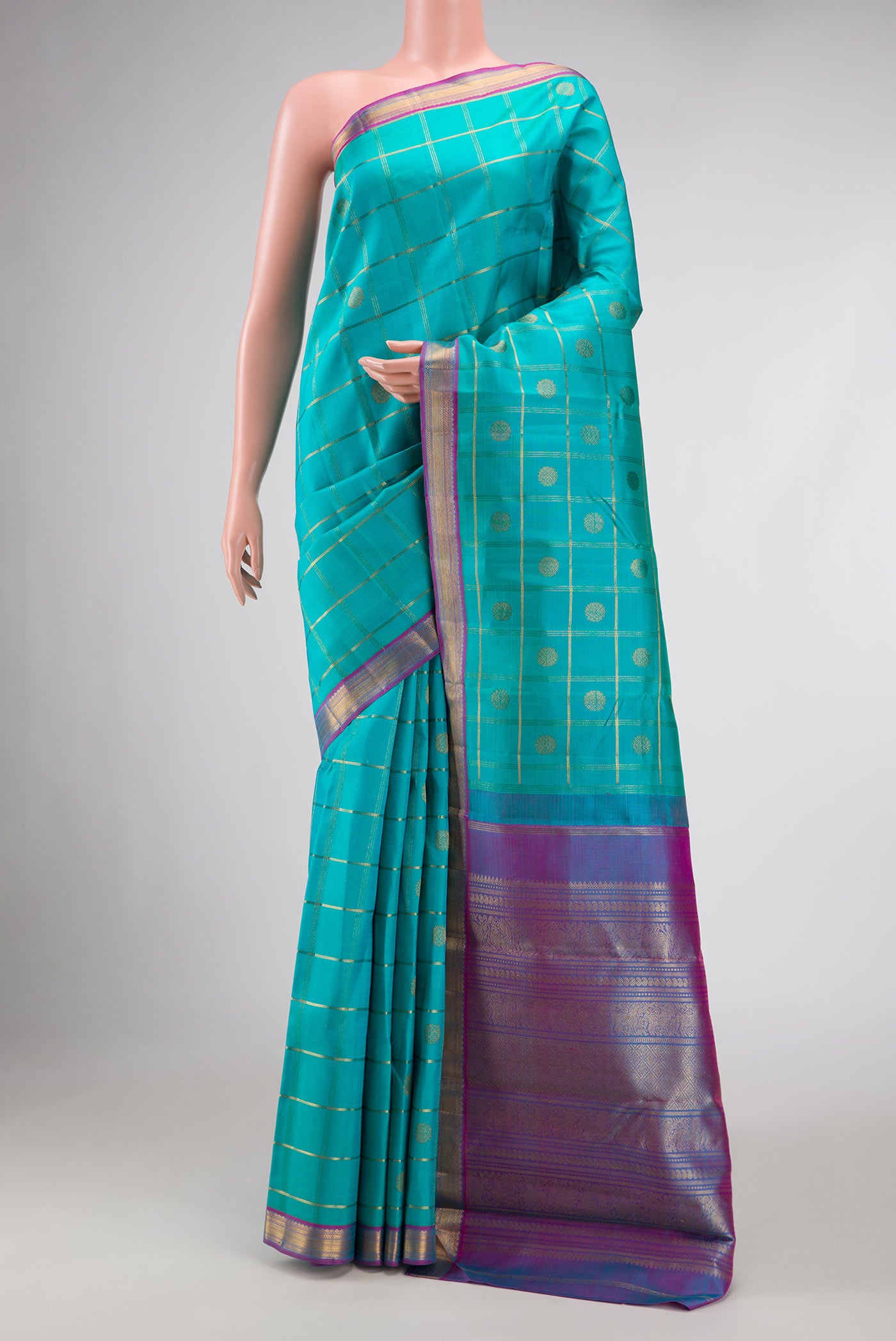 Pure Silk Pure Zari Sky Blue Dual Tone Kanchipuram Saree with Checked design on the body and Zari Border displayed on a mannequin