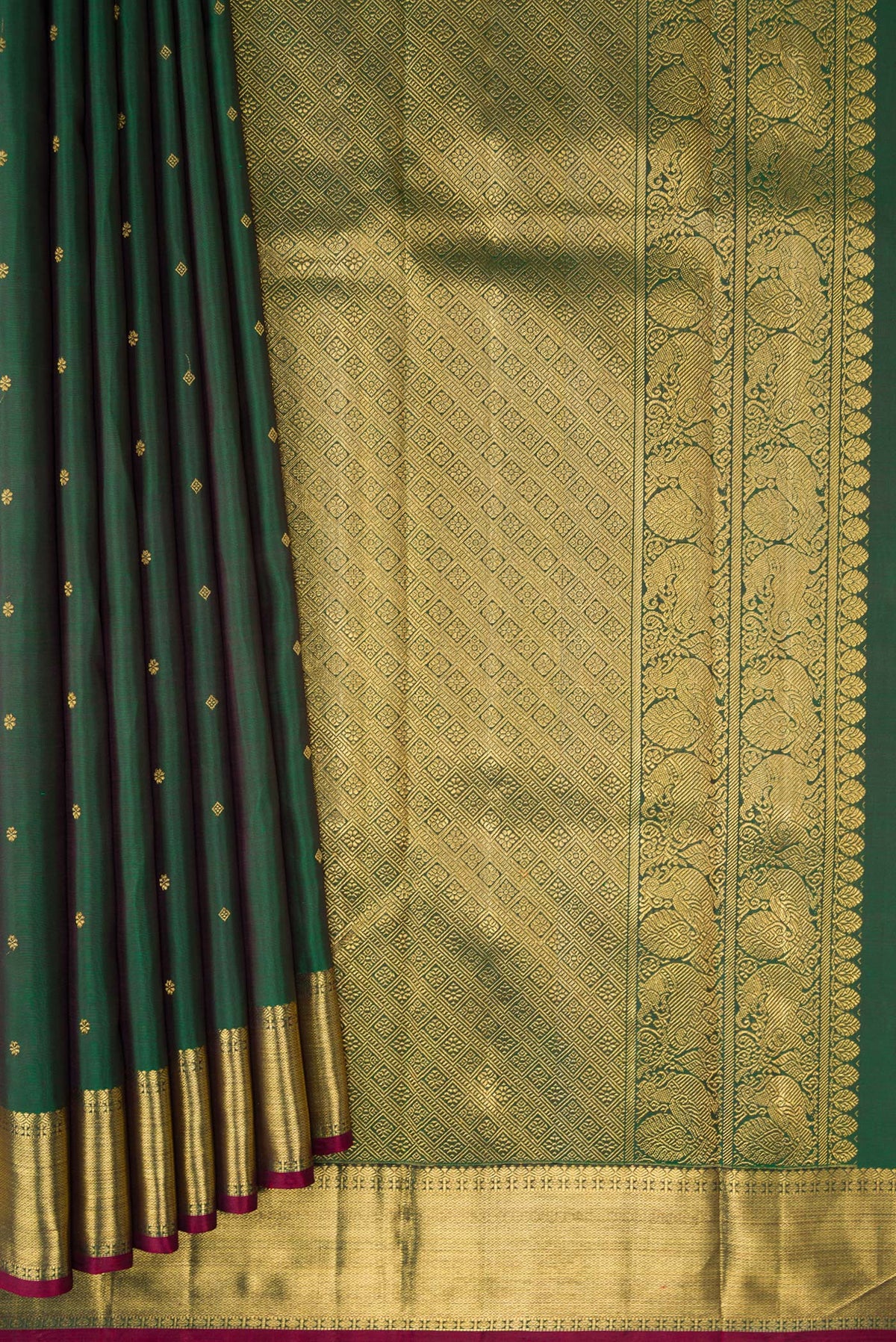 Pleats and pallu of Pure Silk Pure Zari Green Dual Tone Kanjivaram Saree with Zari Butta on the body and Zari Border. 