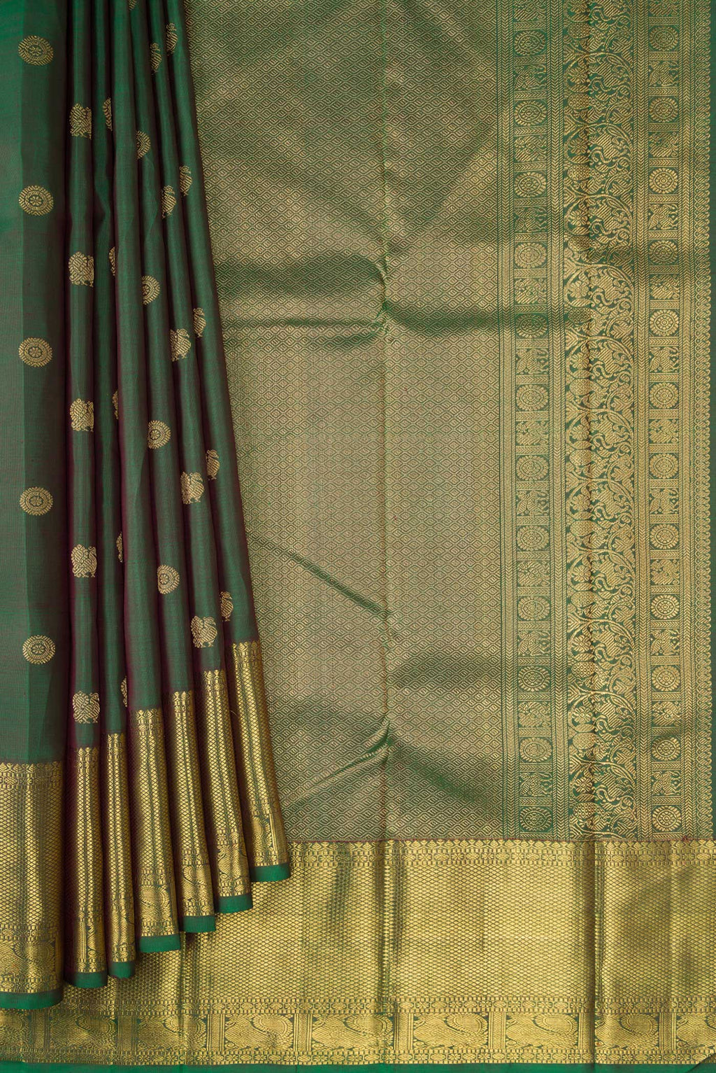 Pleats and pallu of Pure Silk Pure Zari Green Kanjivaram Saree with Zari Butta on the body and Zari Border. 