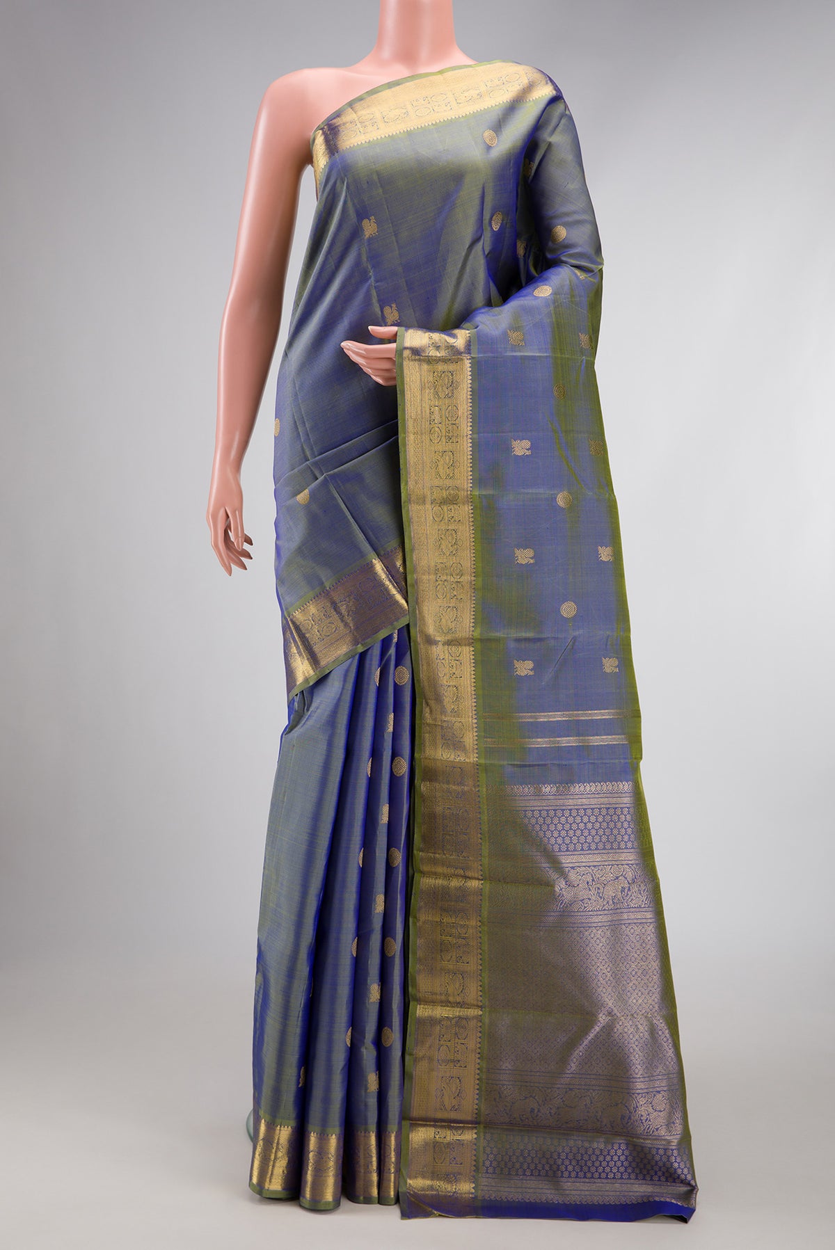 Pure Silk Pure Zari Blue Dual Tone Kanchipuram Saree with Zari Butta on the body and Zari Border.  displayed on a mannequin