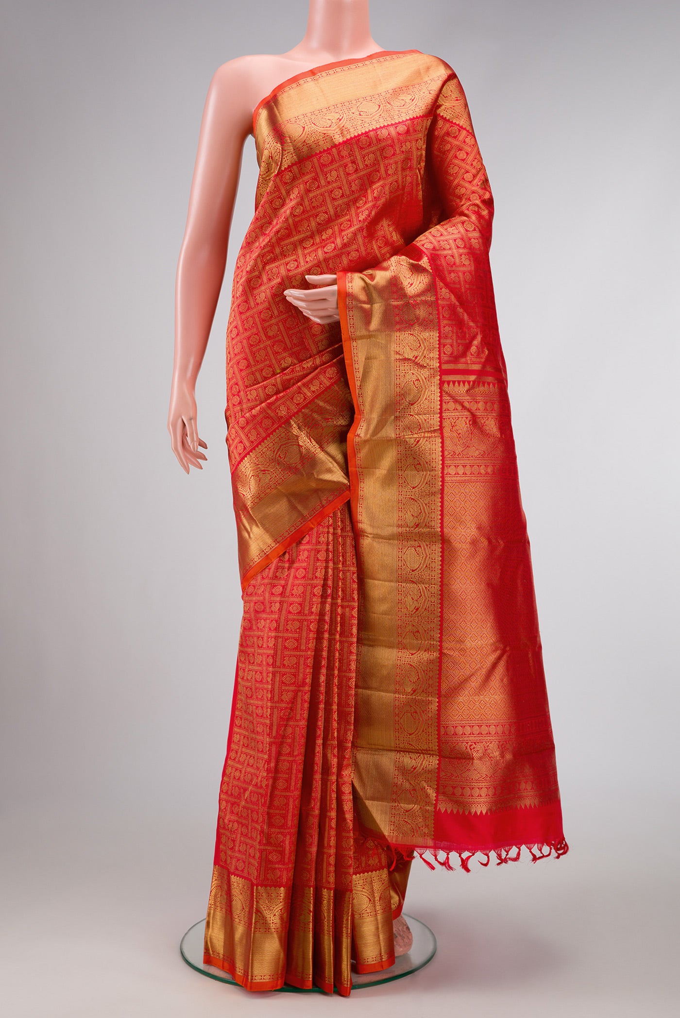 Pure Silk Pure Zari Red Dual Tone Kanjivaram Saree with Zari Brocade on the body and Zari Border.  displayed on a mannequin