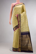 Pure Silk Pure Zari Sandal Kanjivaram Saree with Thread Butta on the body and Zari Border.  displayed on a mannequin