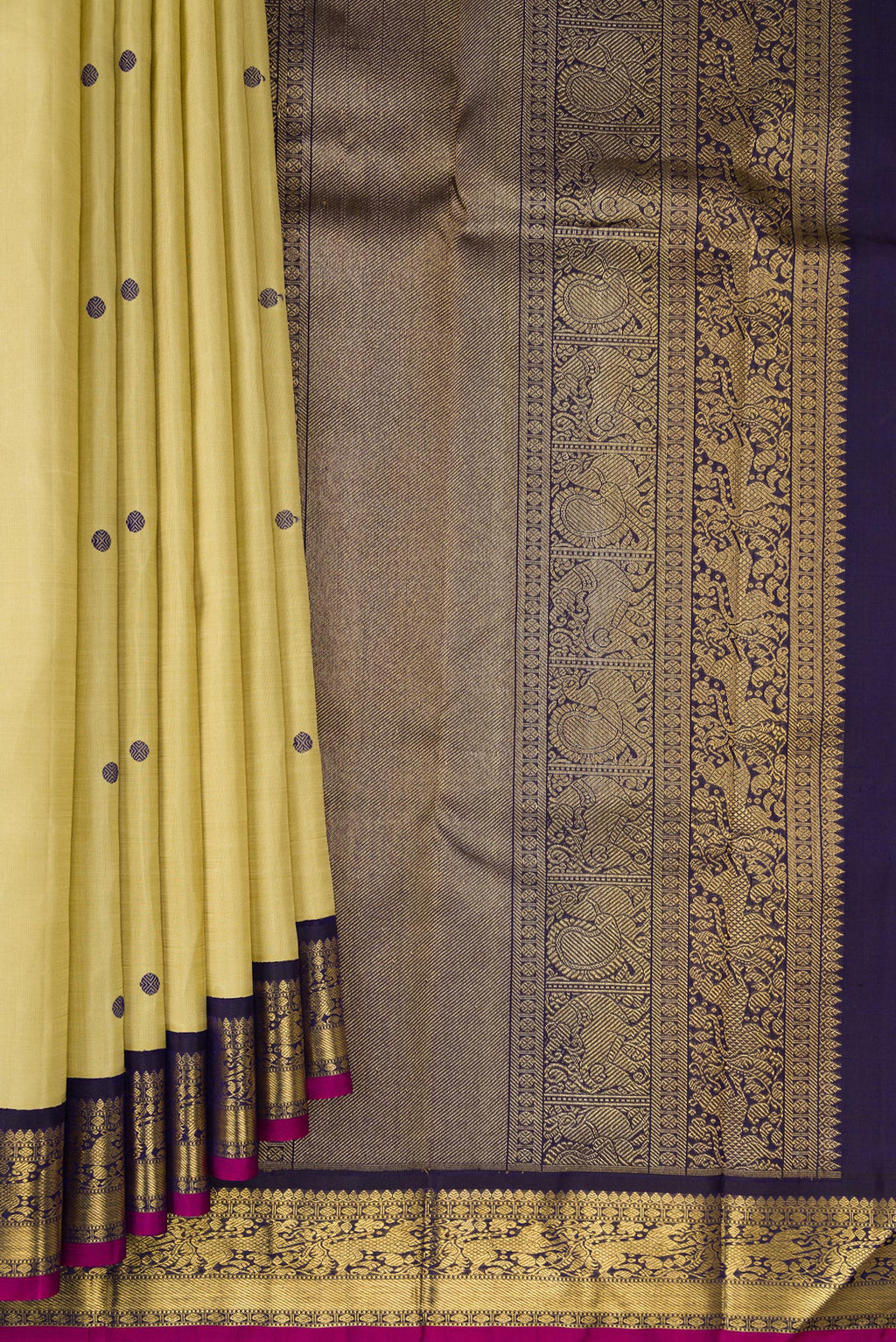 Pleats and pallu of Pure Silk Pure Zari Sandal Kanjivaram Saree with Thread Butta on the body and Zari Border. 
