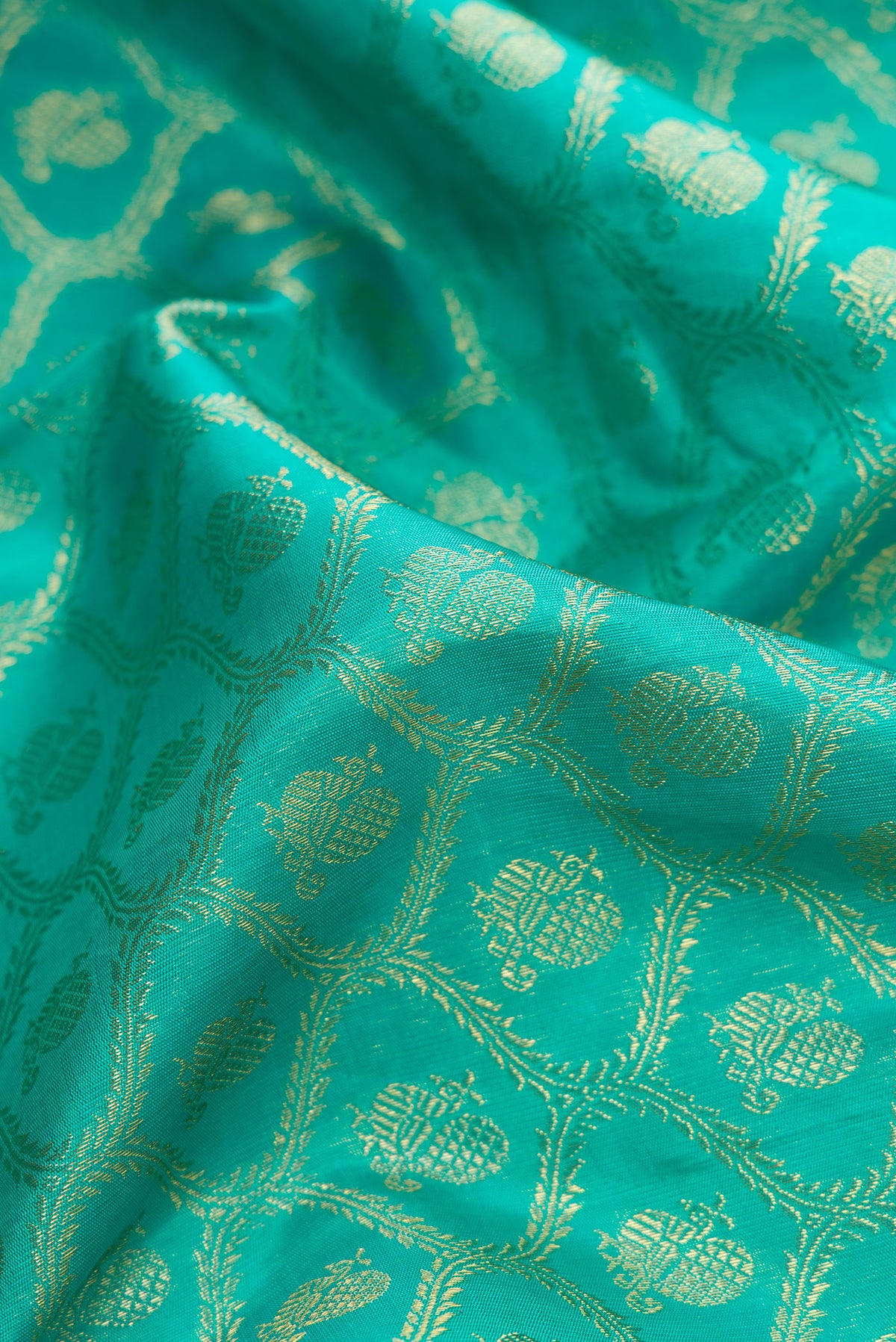 Close up of Pure Silk Pure Zari Sea Green Dual Tone Kanjivaram Saree with Zari Brocade on the body and Zari Border.  displaying folds