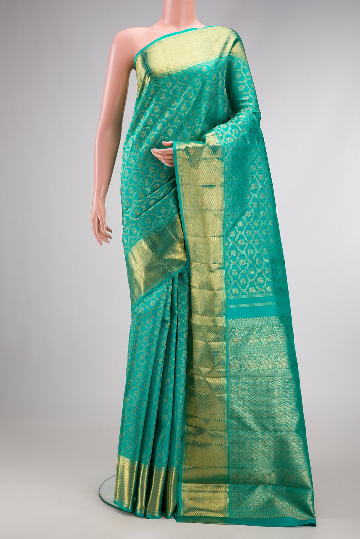 Pure Silk Pure Zari Sea Green Dual Tone Kanjivaram Saree with Zari Brocade on the body and Zari Border.  displayed on a mannequin