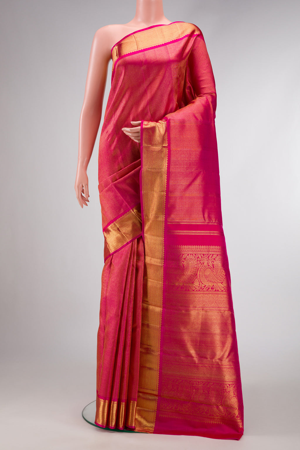 Pure Silk Pure Zari Pink Dual Tone Kanjivaram Saree with Zari Brocade on the body and Zari Border.  displayed on a mannequin