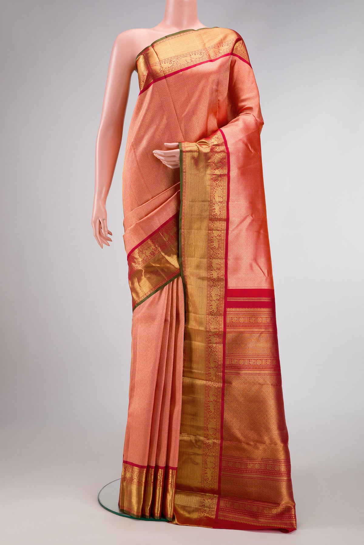 Pure Silk Pure Zari Coral Dual Tone Kanjivaram Saree with Zari Brocade on the body and Zari Border.  displayed on a mannequin