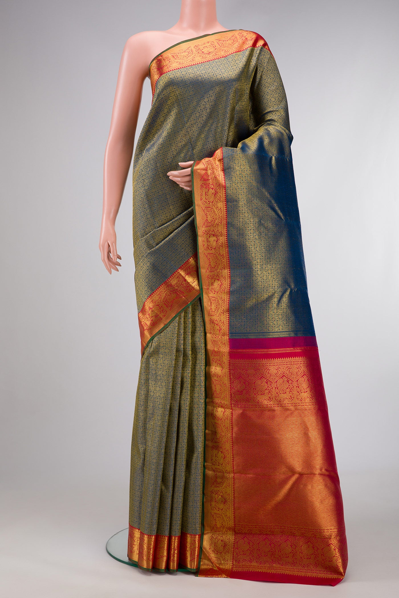 Pure Silk Pure Zari Peacock Blue Dual Tone Kanjivaram Saree with Zari Brocade on the body and Zari Border.  displayed on a mannequin