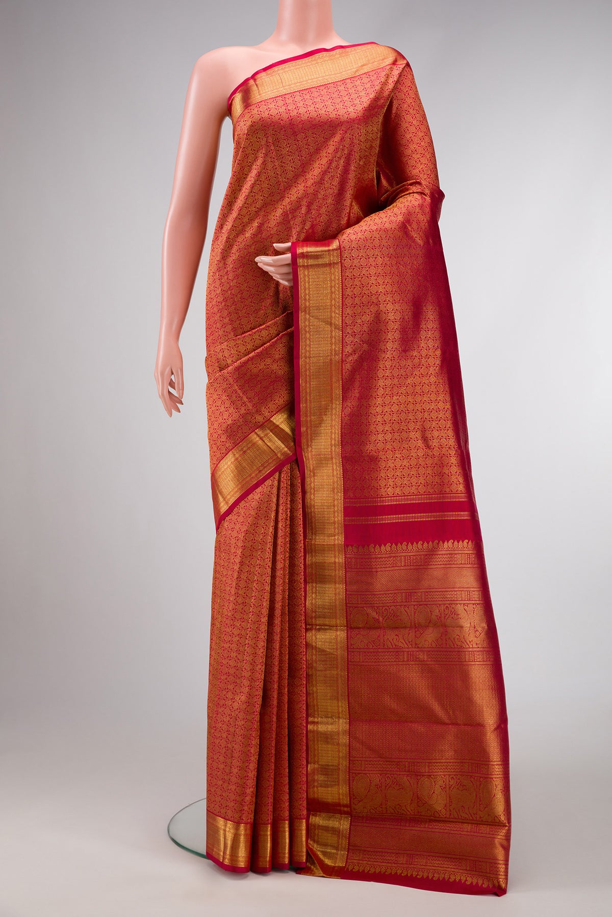 Pure Silk Pure Zari Red Dual Tone Kanjivaram Saree with Zari Brocade on the body and Zari Border.  displayed on a mannequin