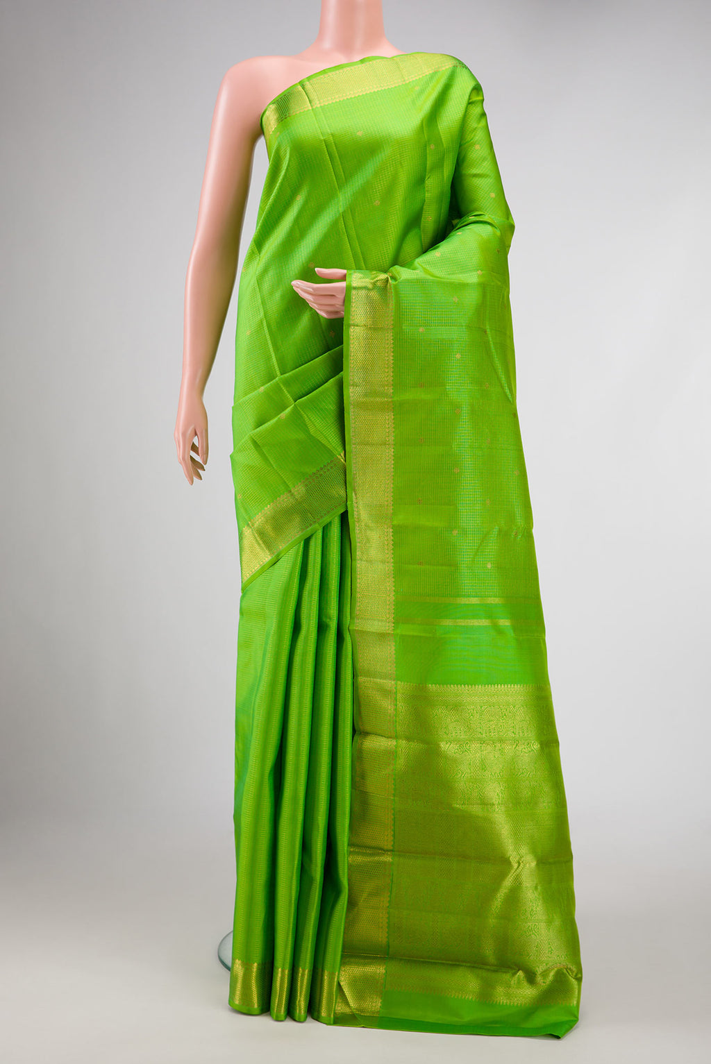 Pure Silk Pure Zari Parrot Green Dual Tone Kanchipuram Saree with Checked design on the body and Zari Border displayed on a mannequin