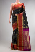 Pure Silk Pure Zari Black Kanjivaram Saree with Checked design on the body and Zari Border.  displayed on a mannequin