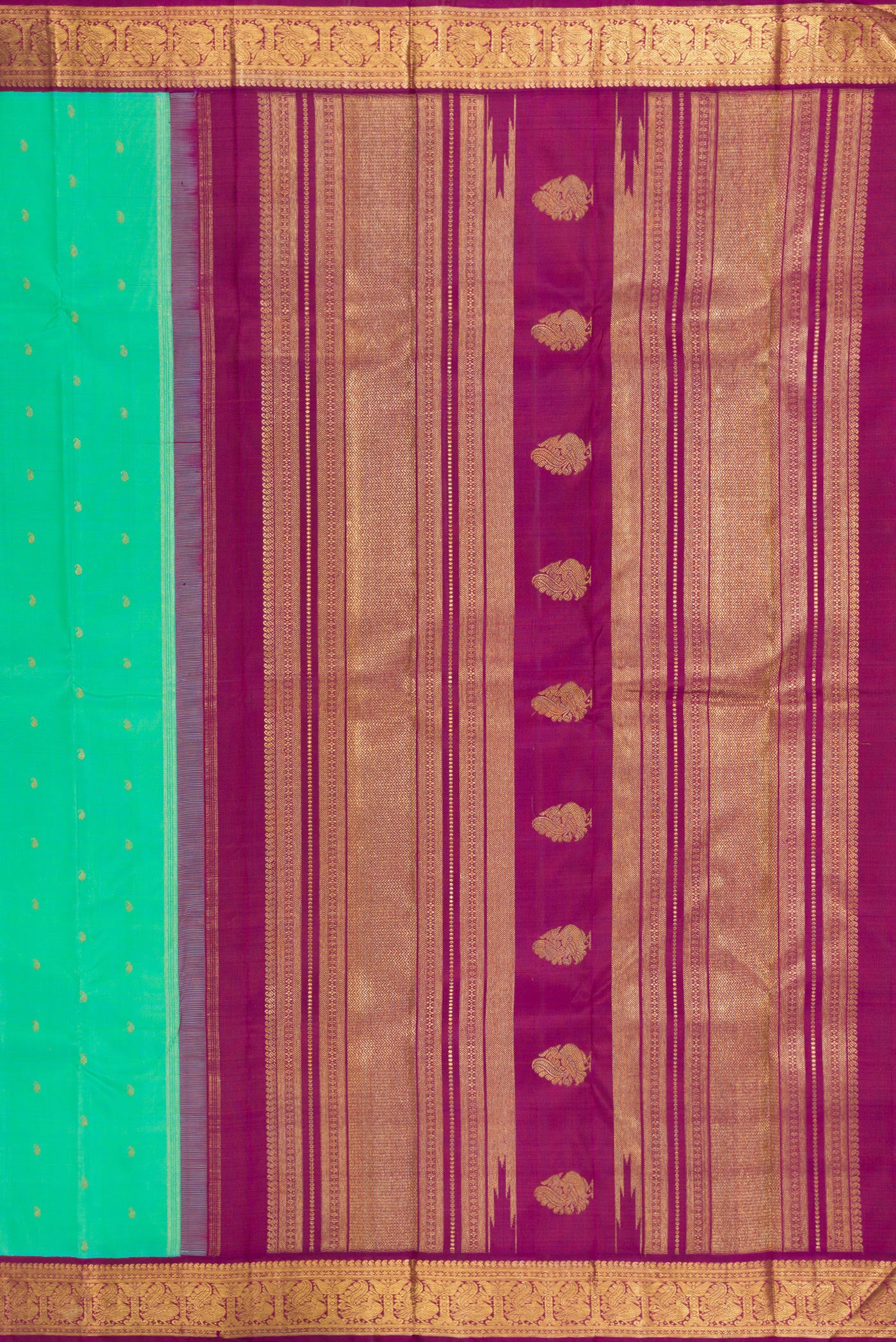 Close up image of the pallu of Pure Silk Pure Zari Sea Green Kanjivaram Saree with Zari Butta on the body and Zari Border. 